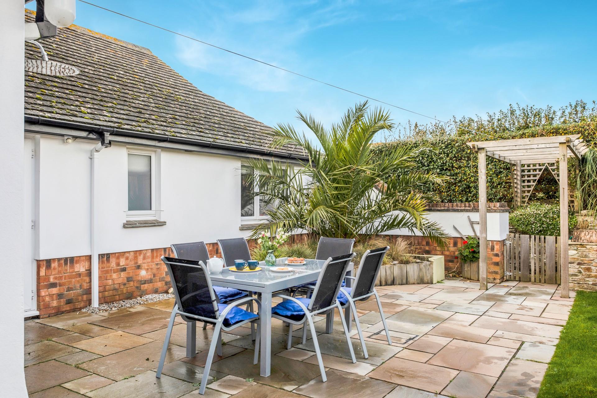 The outside furniture is perfect for taking meals outside in the summer sun.