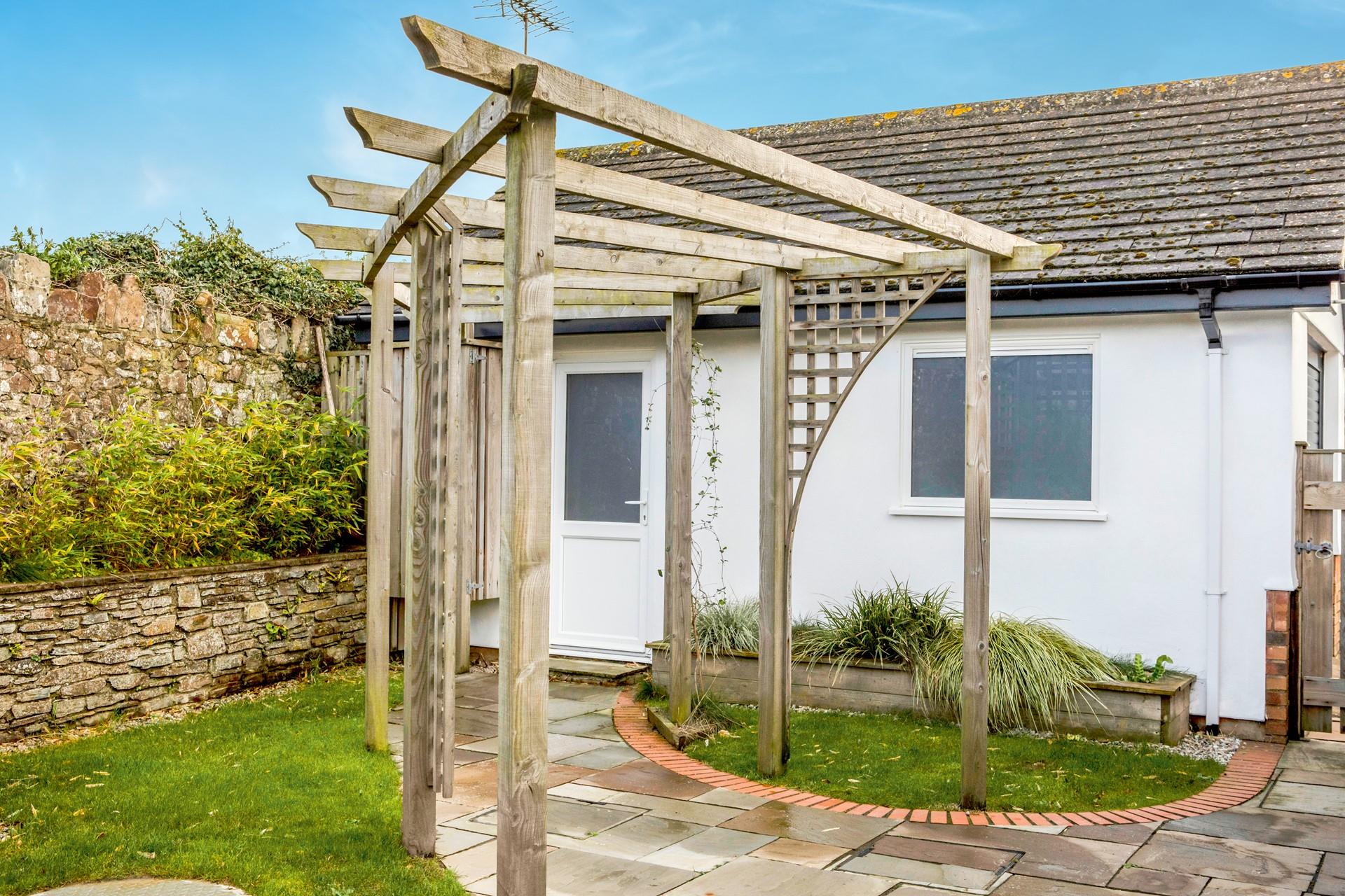 Watch the little ones play in the garden whilst you sip a cold drink.