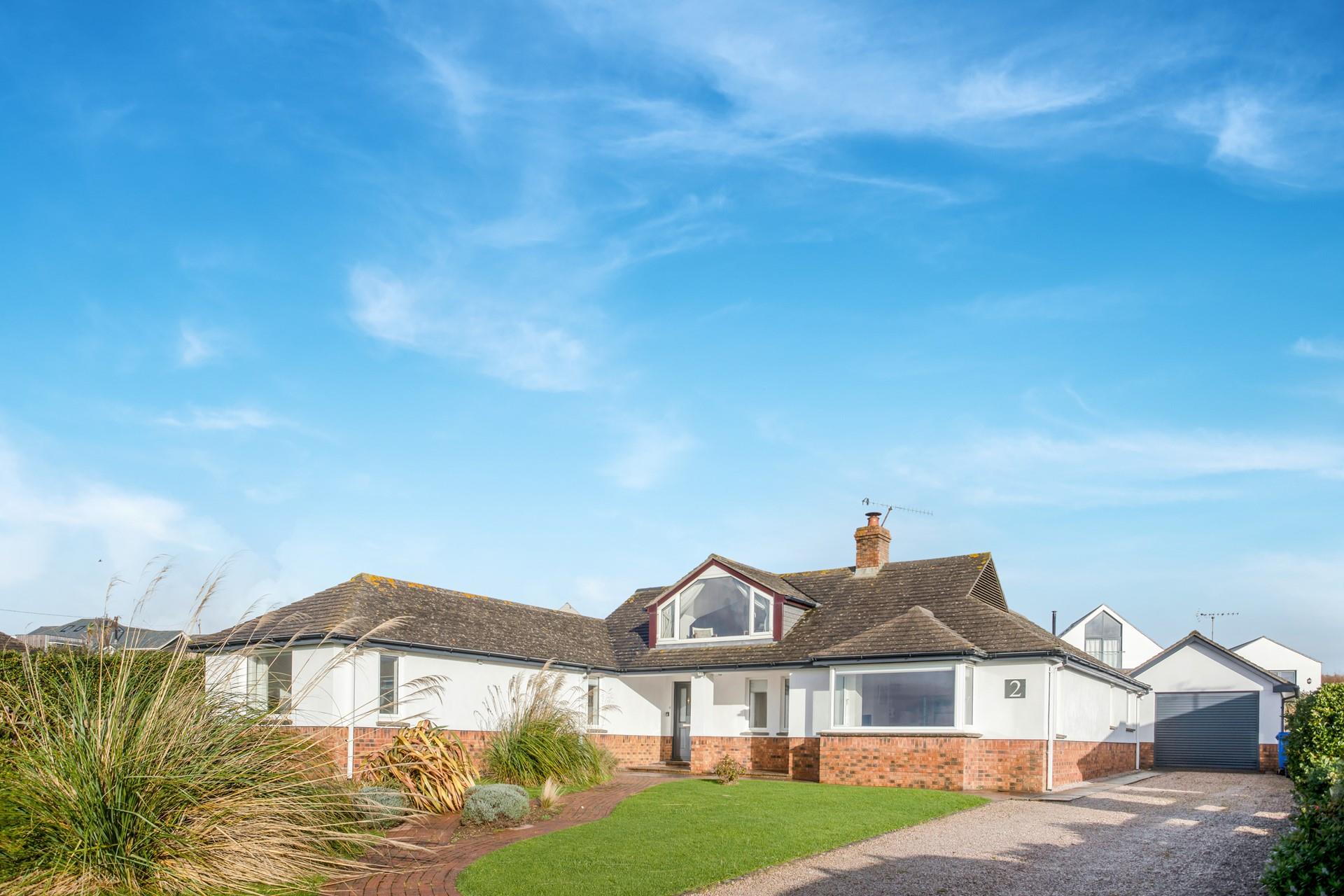 There is a large drive way with plenty of parking.