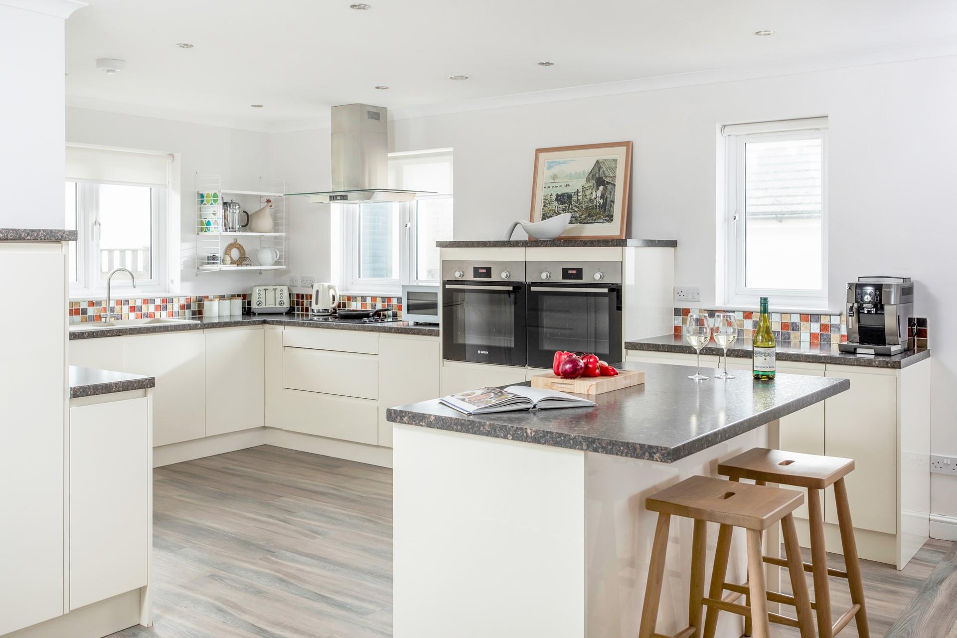 The kitchen has all the appliances you need, including a double oven and coffee machine.