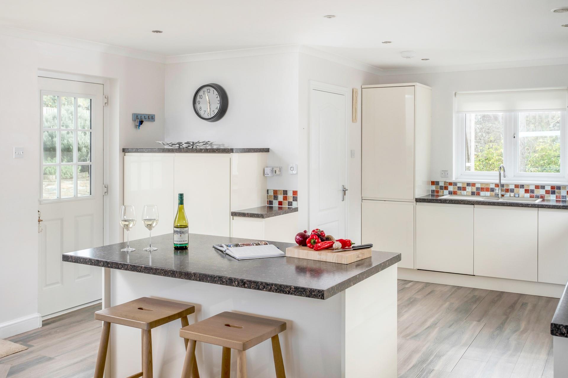 The kitchen is large and well-equipped for cooking meals.