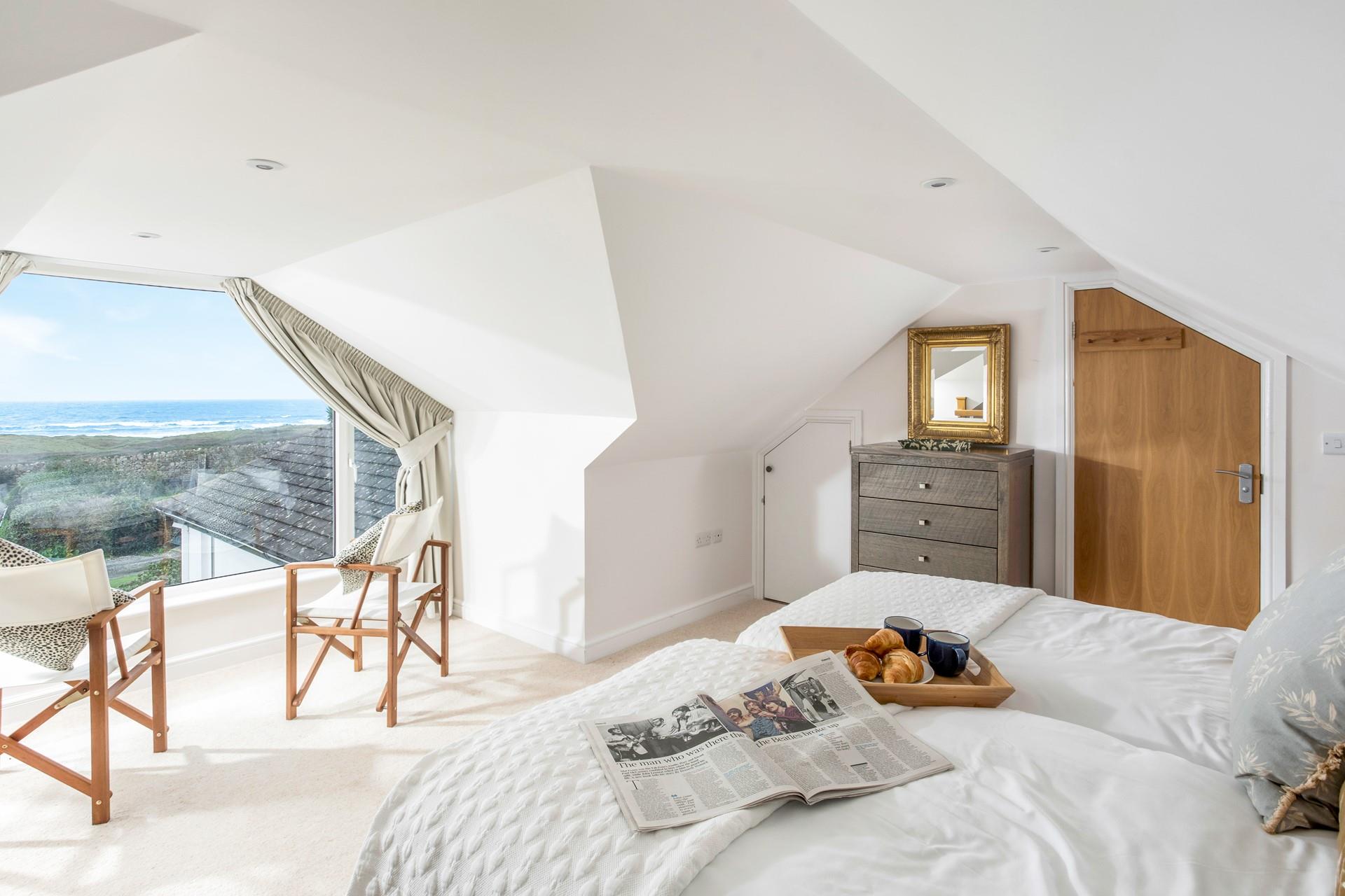 Wake up to stunning views across Widemouth Bay.