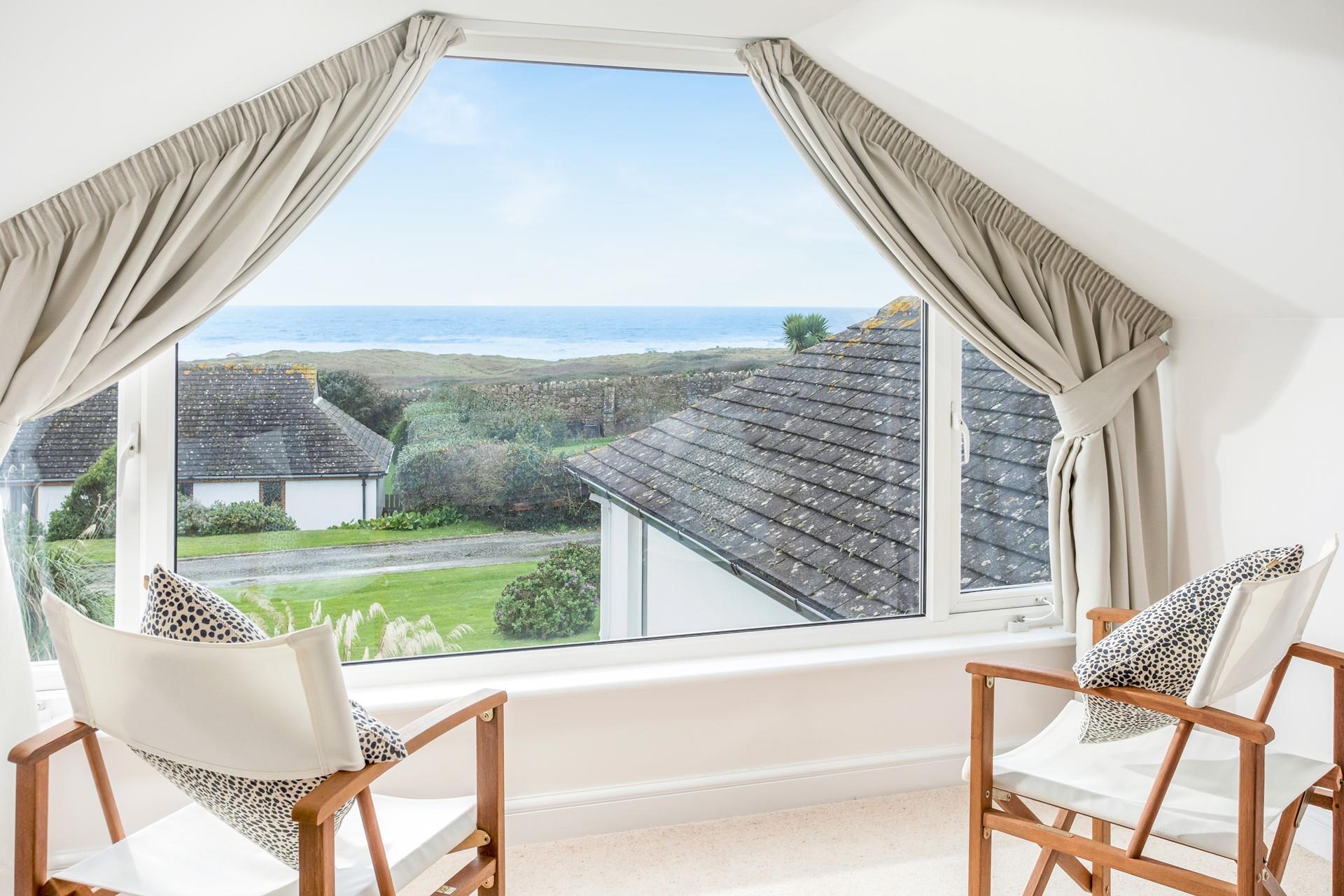 The large window is the perfect spot for a cuppa and a good book.