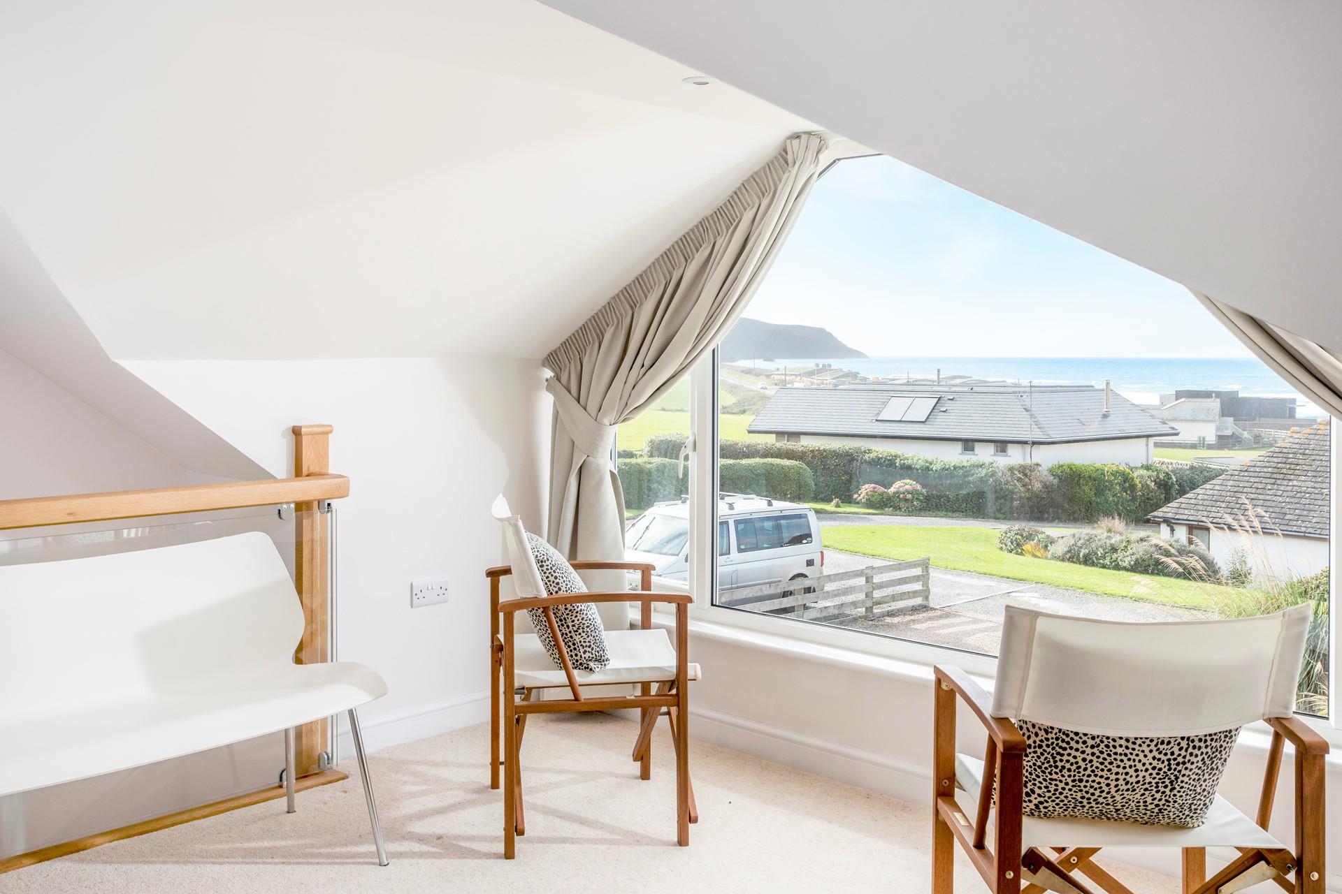 Open the curtains to see the stunning sea view.