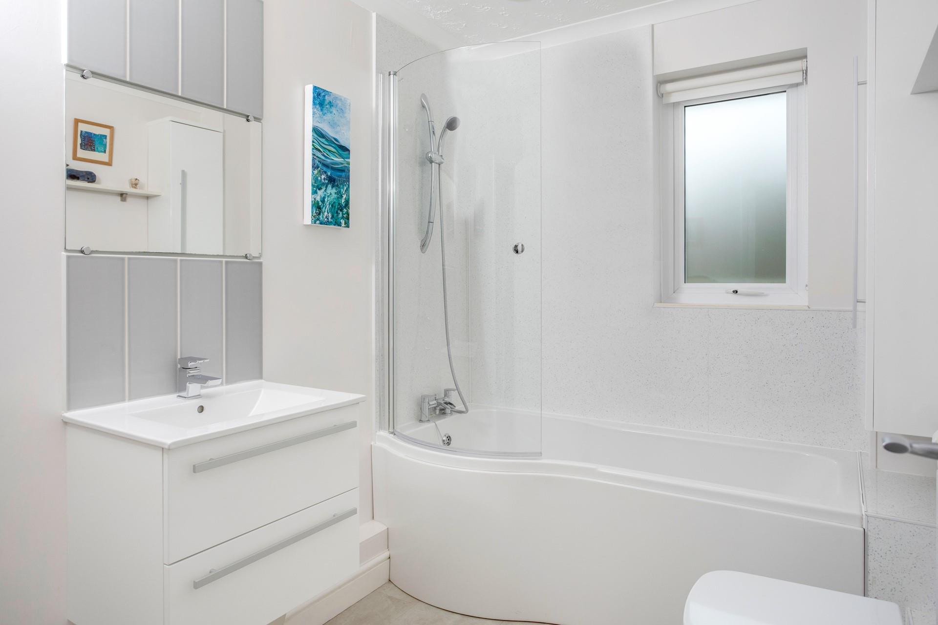 The family bathroom has a bath to relax and unwind in the evening.