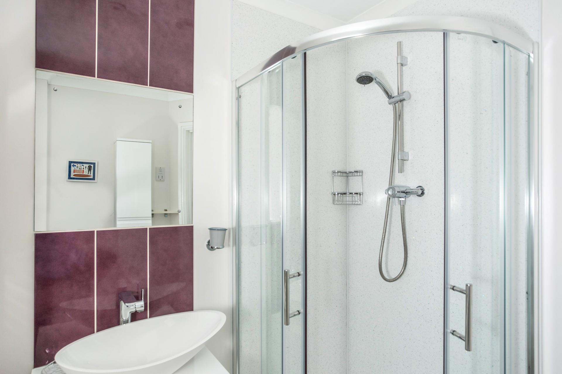 Wash off sandy toes in the shower after a day on Widemouth Bay beach.