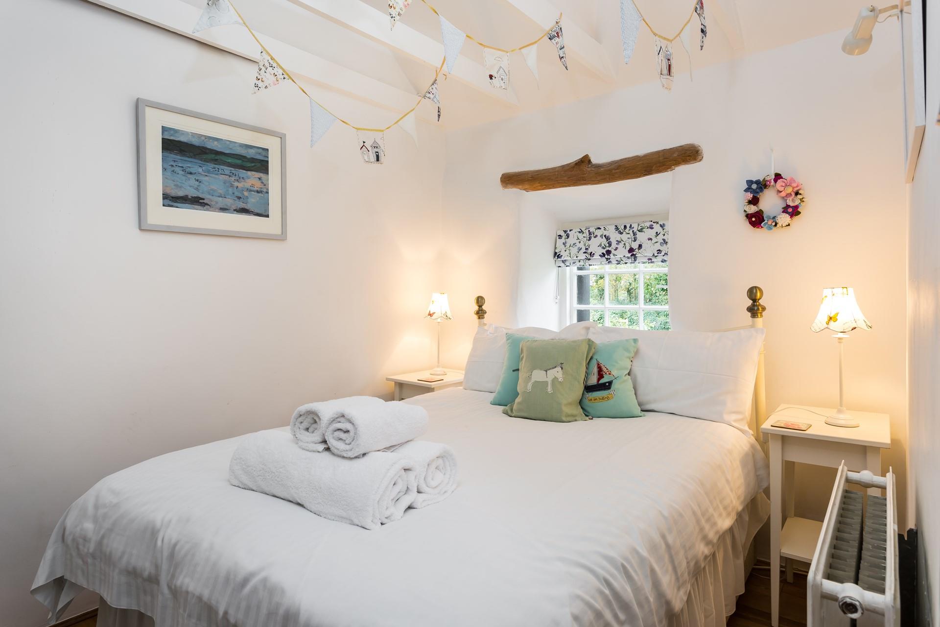 The bedroom is full of cottage charm and provides a relaxing night's sleep.