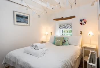 The bedroom is full of cottage charm and provides a relaxing night's sleep.