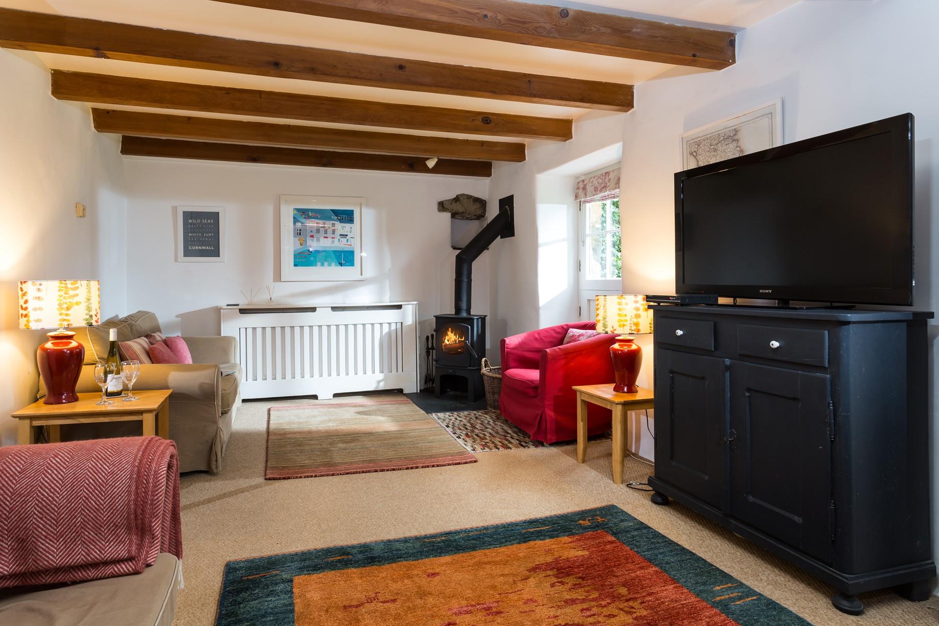 Pour yourself a glass of wine to enjoy in the cosy sitting room.