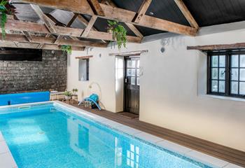 Take a dip in the pool, shared with the other cottages at Penbroath Retreats.