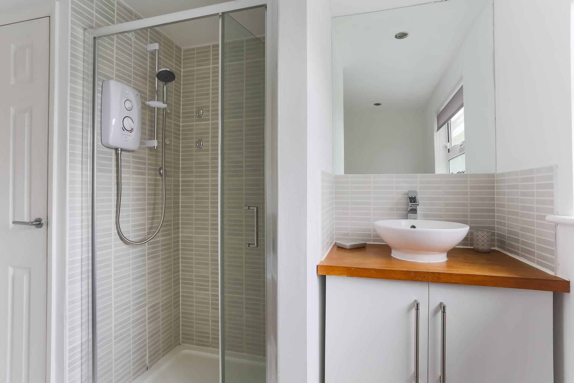 Wash off sandy toes in the shower after a day on the beach.