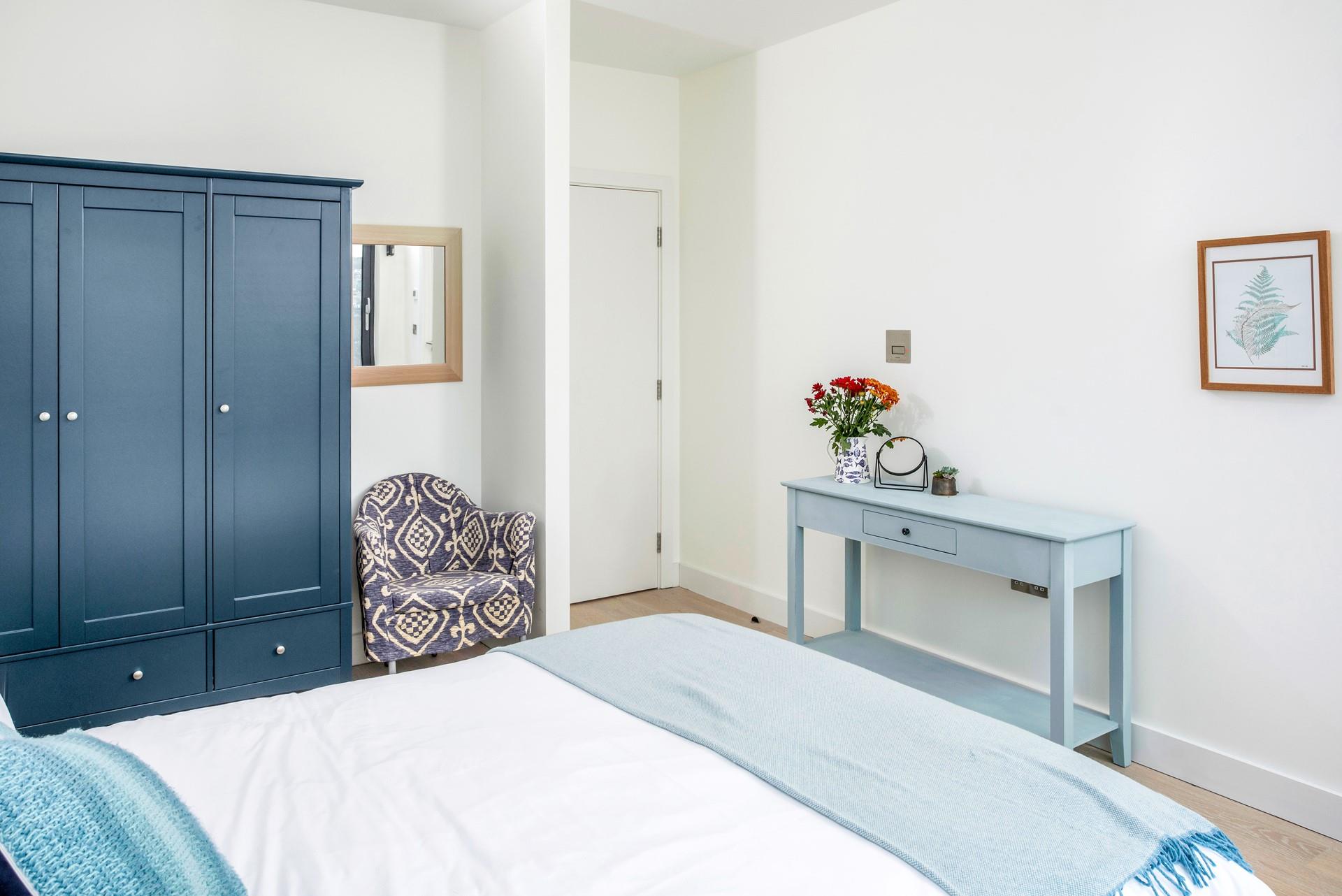 Bedroom 2 has a spacious king size bed for a peaceful night's slumber.