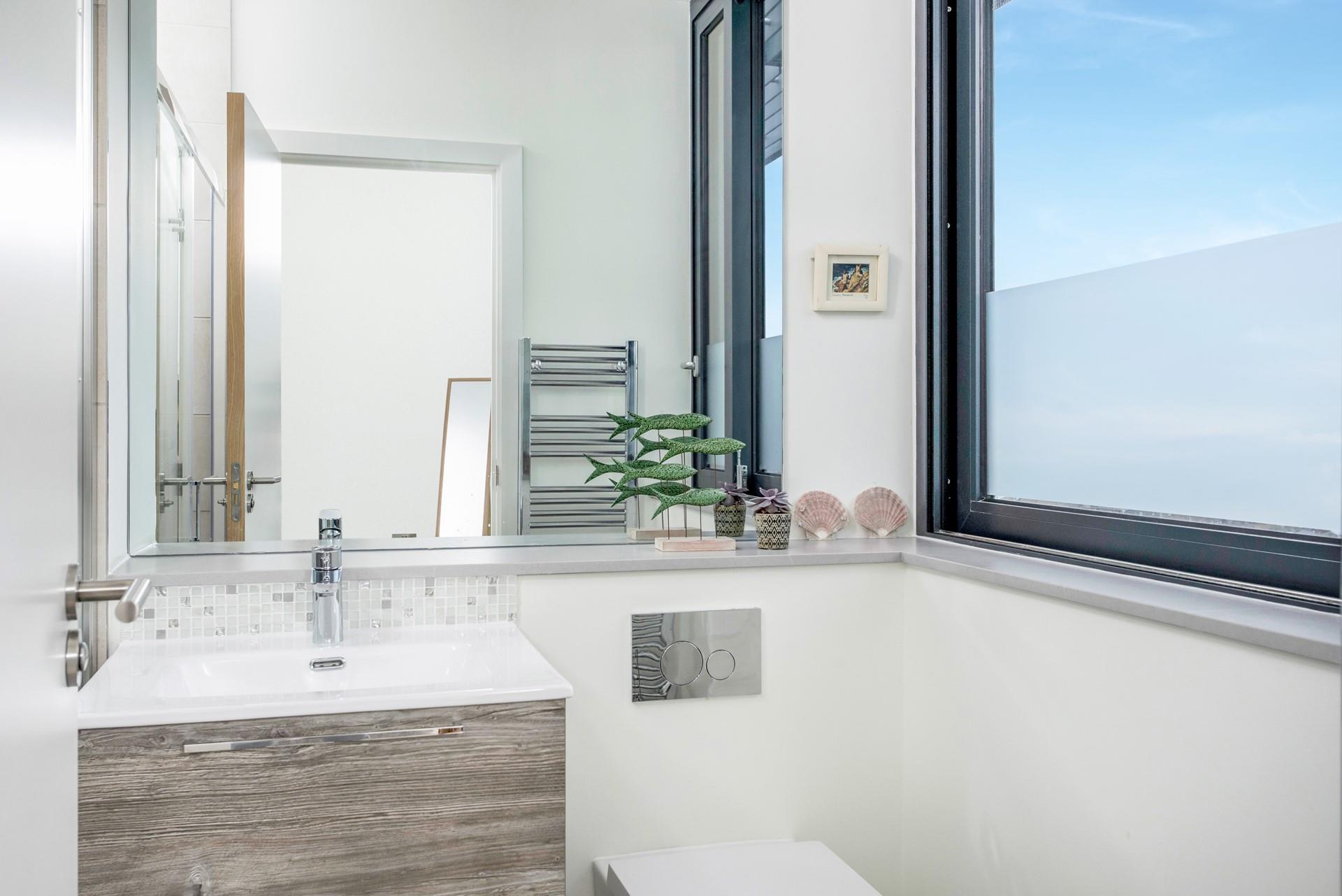 Take warm fluffy towels straight from the heated towel rail after a morning shower.