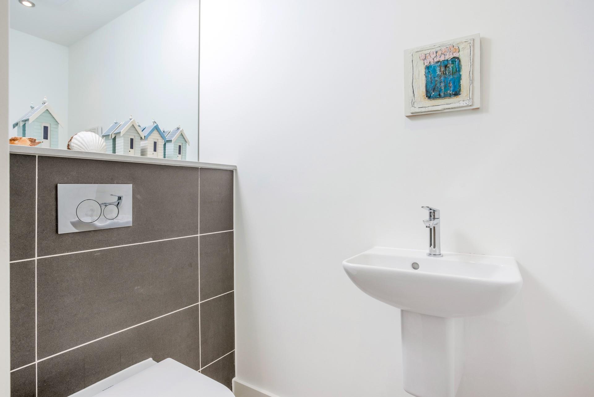 The cloakroom has an additional WC and basin.