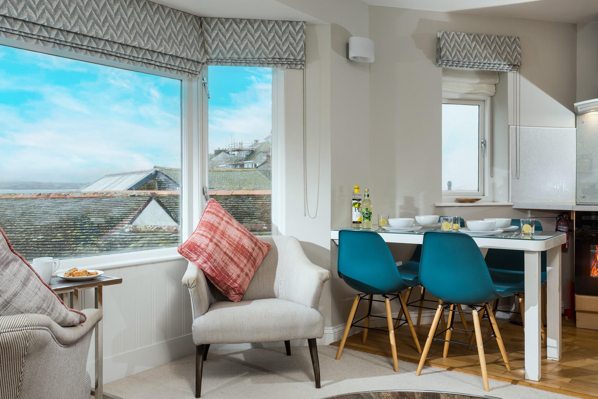 Sit in the window and watch the waves with a cuppa.