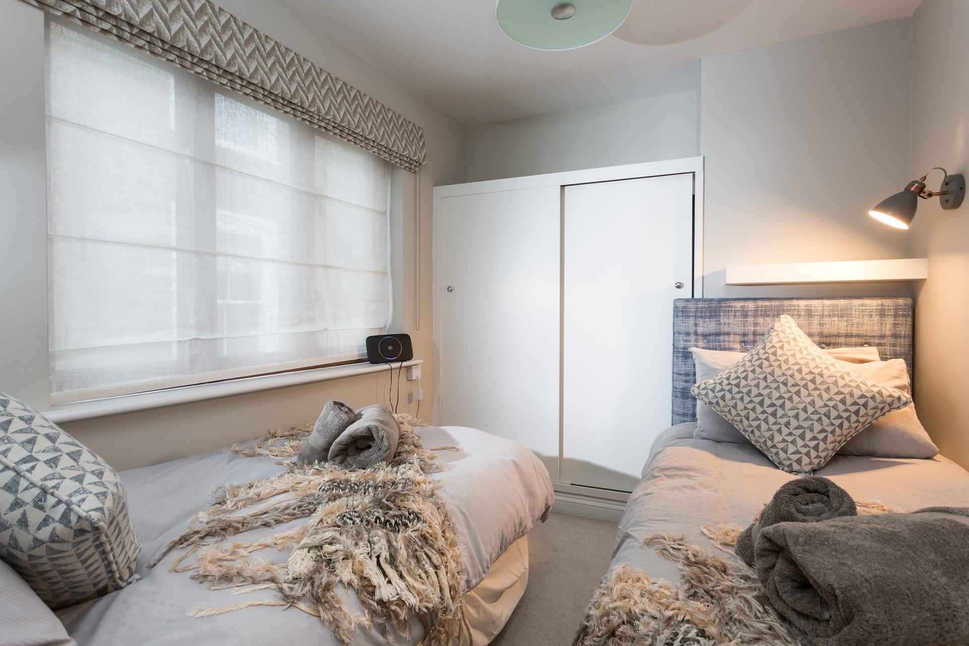 The twin beds provide flexible sleeping arrangements.