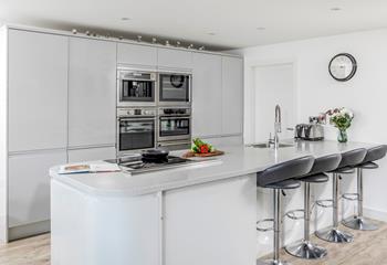 The kitchen is spacious and well-equipped for cooking meals.