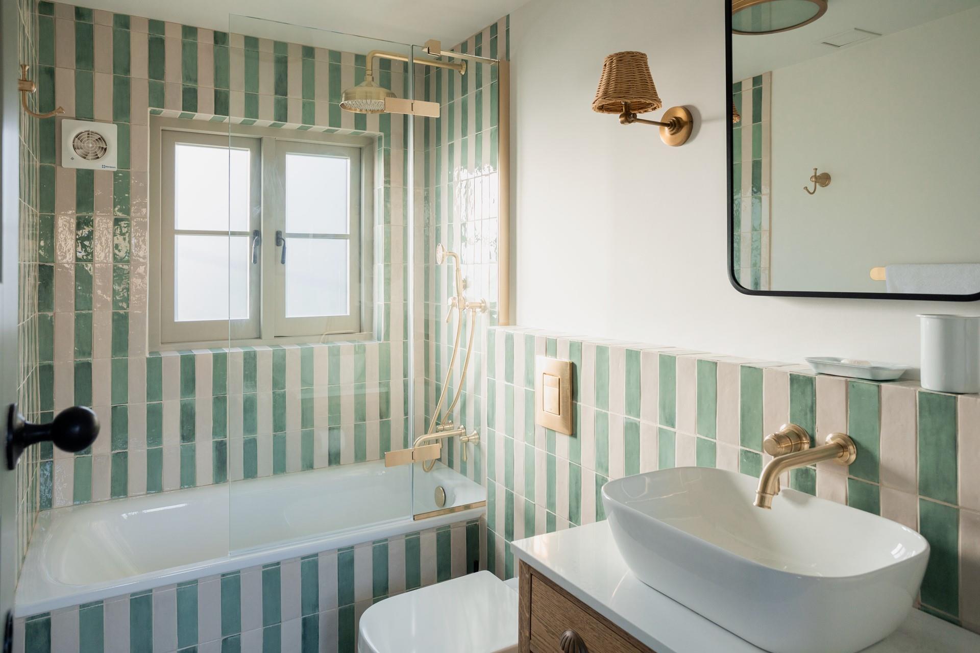 Enjoy a long soak in the stunning bathroom.