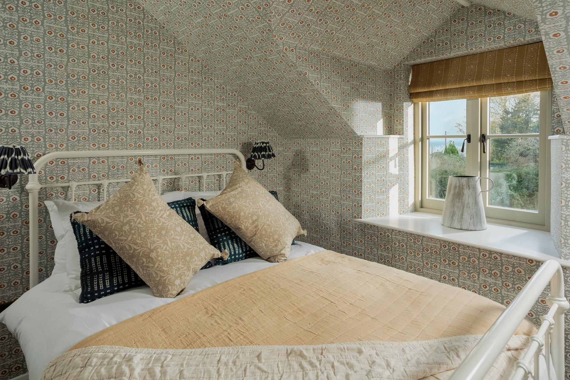 The double bedroom is a tranquil oasis.