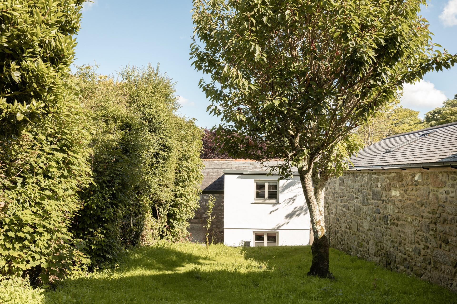 The garden is a sunny spot to relax and unwind.