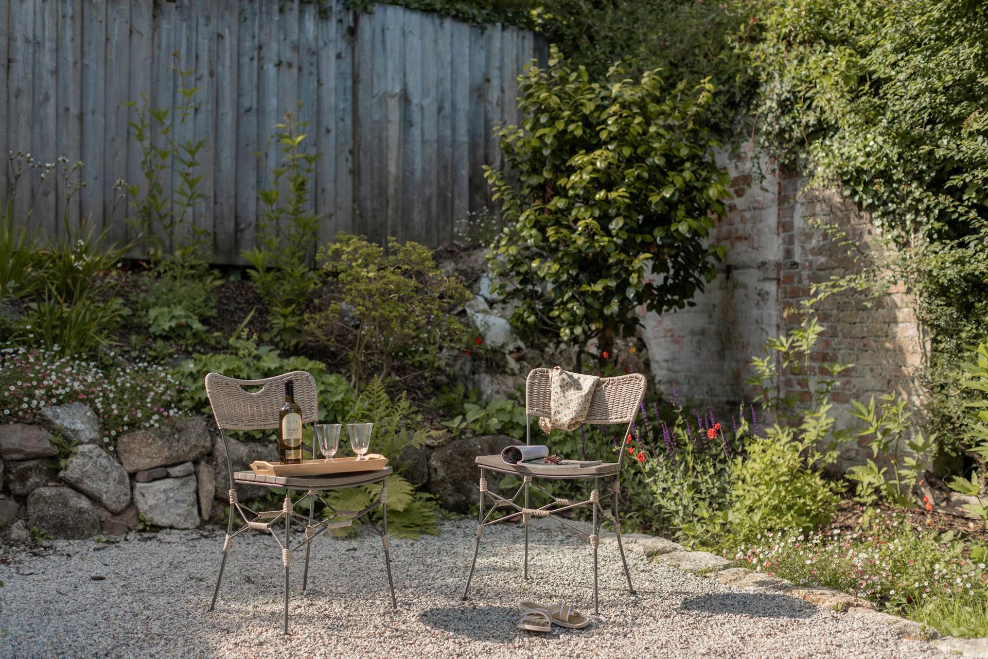 The gardens are blooming with flowers in the sun.