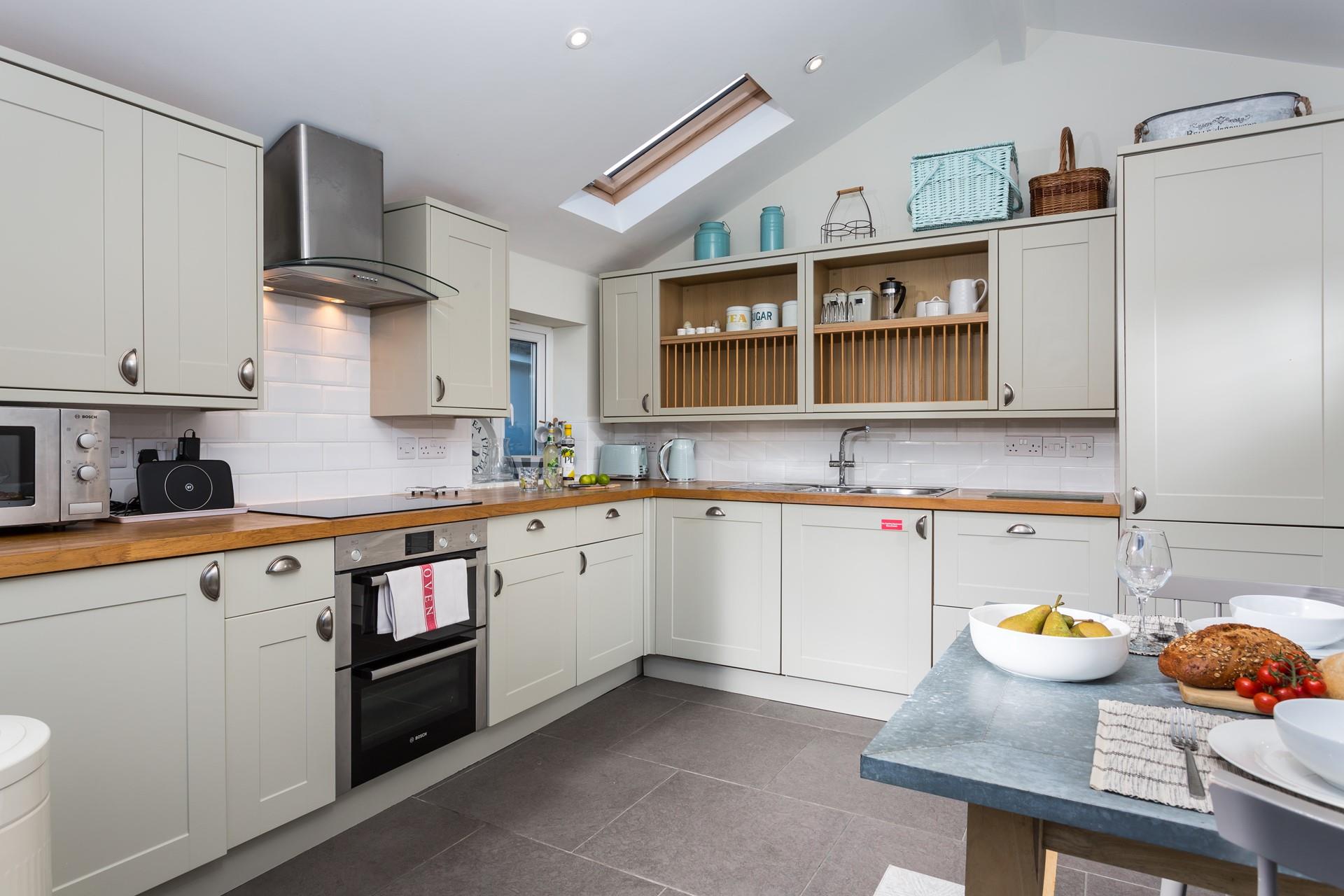 The large kitchen is well-equipped for cooking tasty meals.