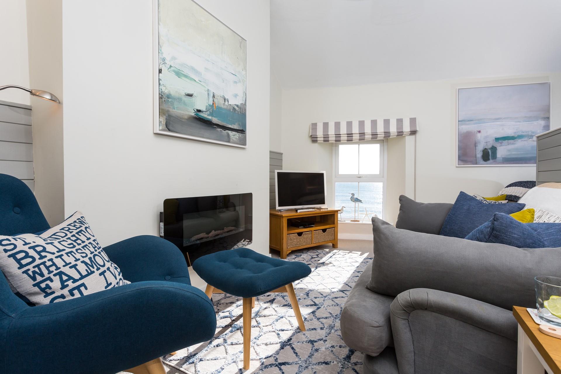 The sitting room is decorated with soothing beachy tones.