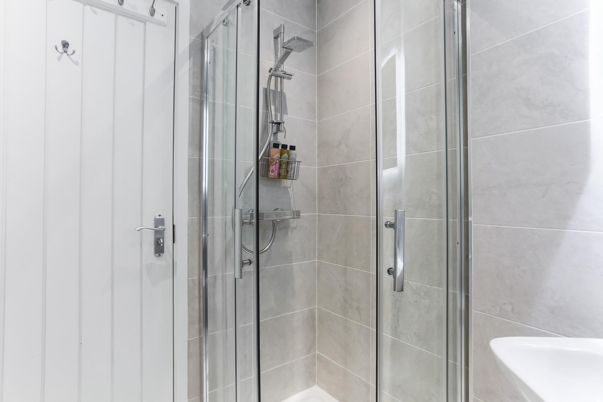 Wash off sandy toes in the shower after a day on the sand.