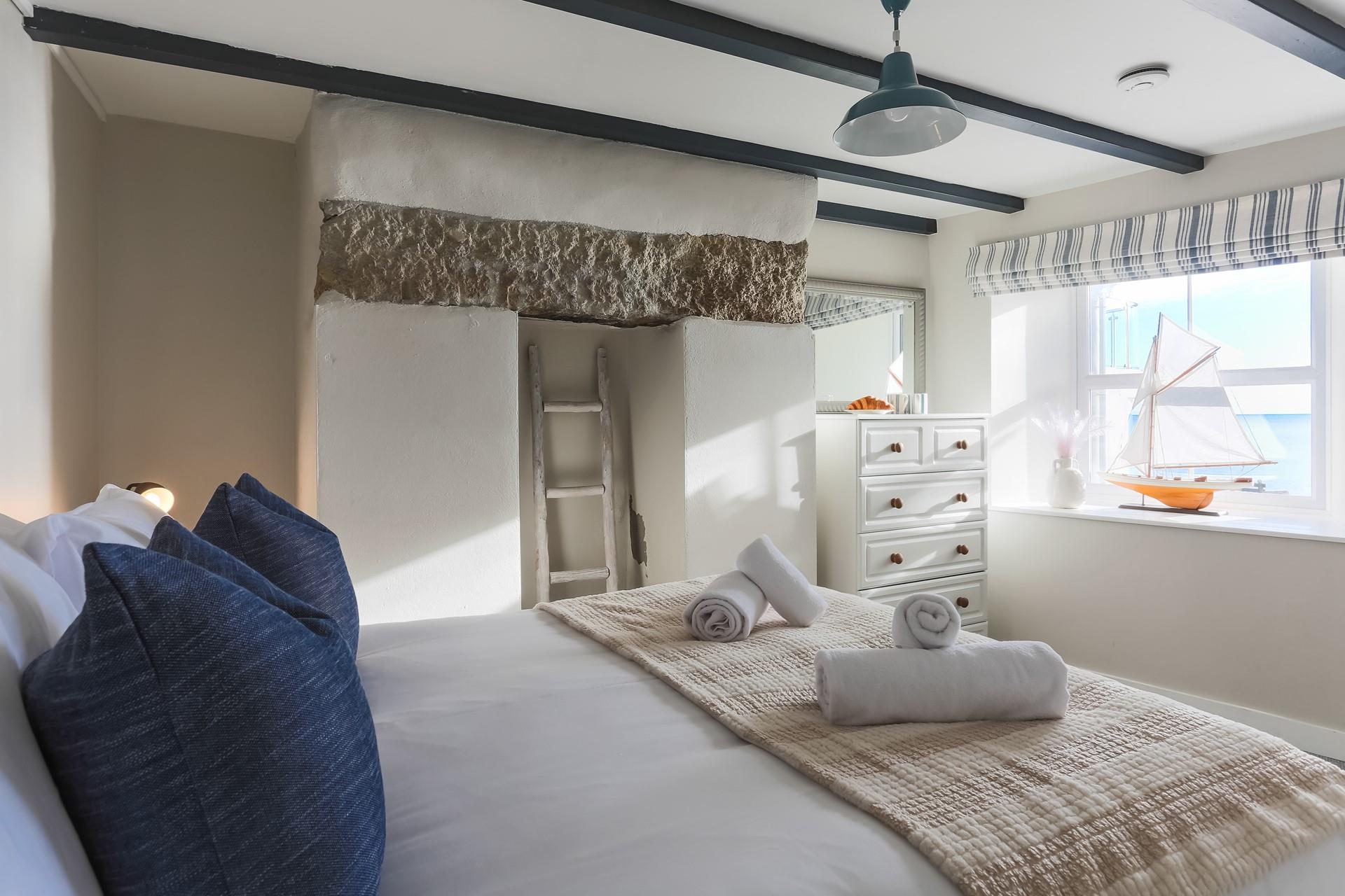 Fresh towels and soft sheets await in bedroom 1.