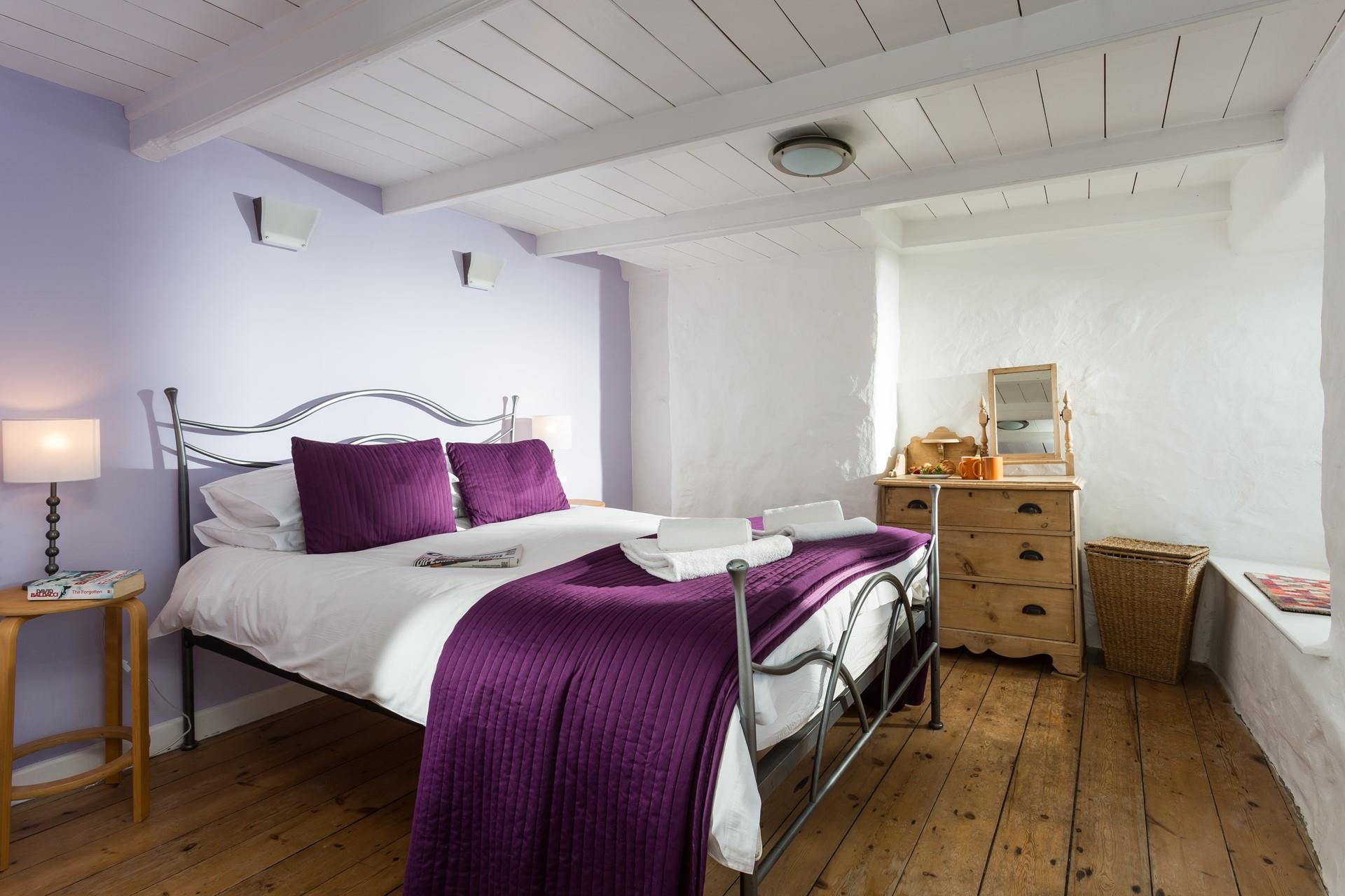 Bedroom 1 has a spacious king-size bed for a dreamy night's sleep.