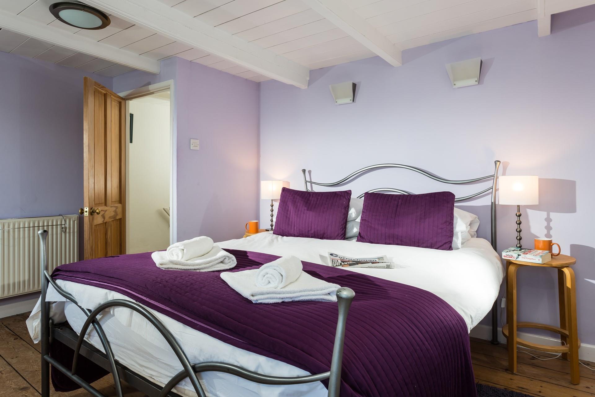 Spend the day exploring the coast path on foot and come back to the cosy bedroom.