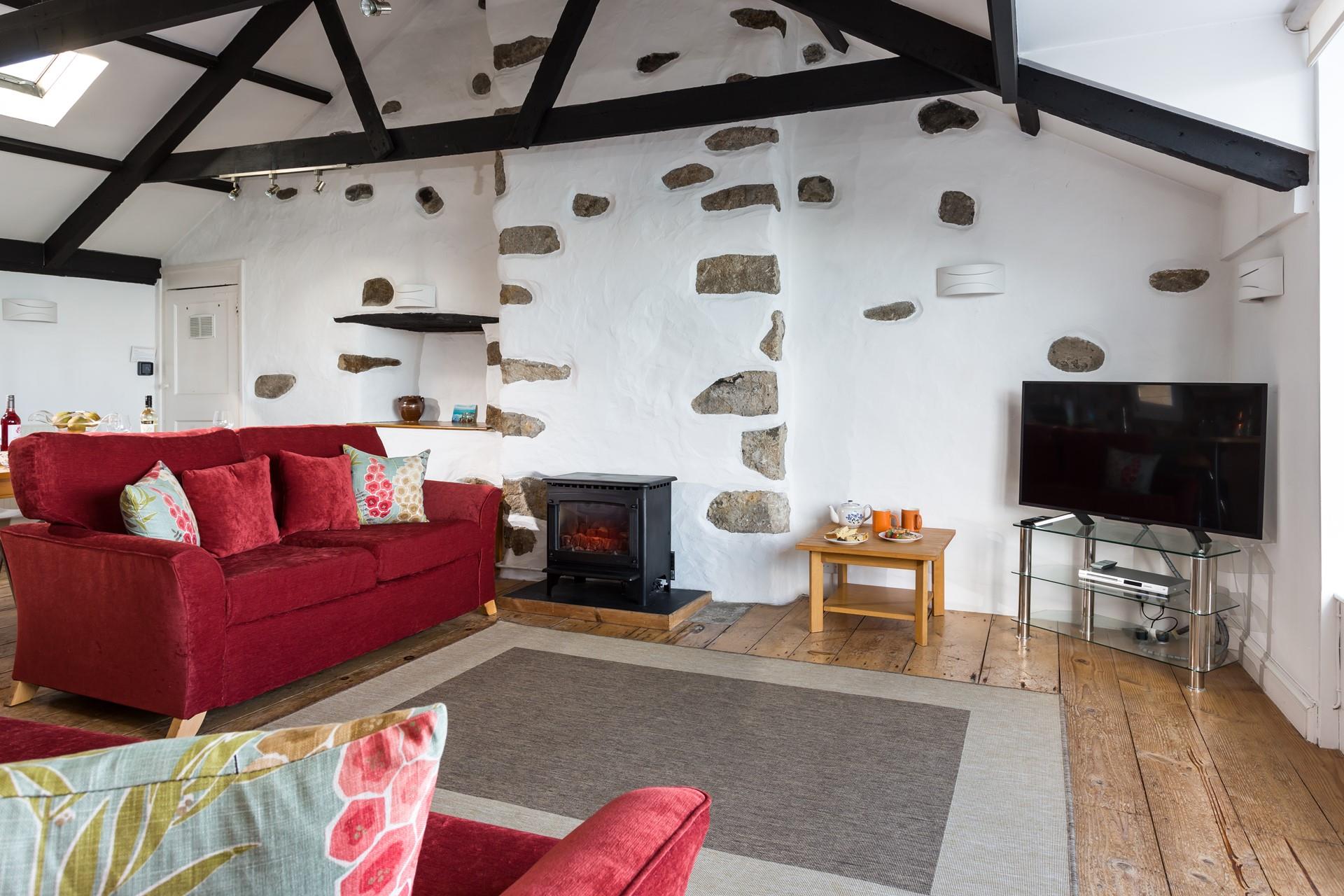 The sitting room is cosy and perfect for relaxing nights while watching the sunset.