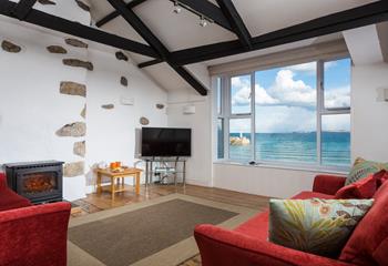 The sitting room offers stunning sea views of St Ives Bay and lighthouse.