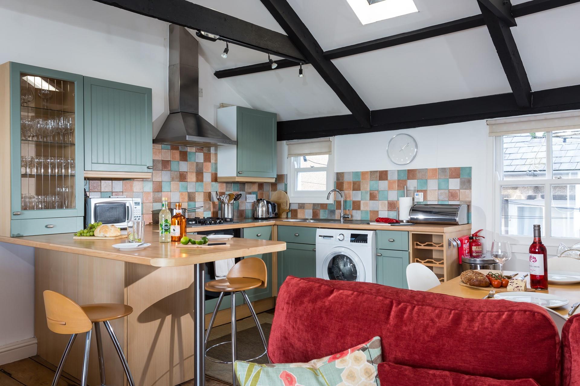 The open-plan kitchen and dining room is perfect for cooking and dining together with family or friends.