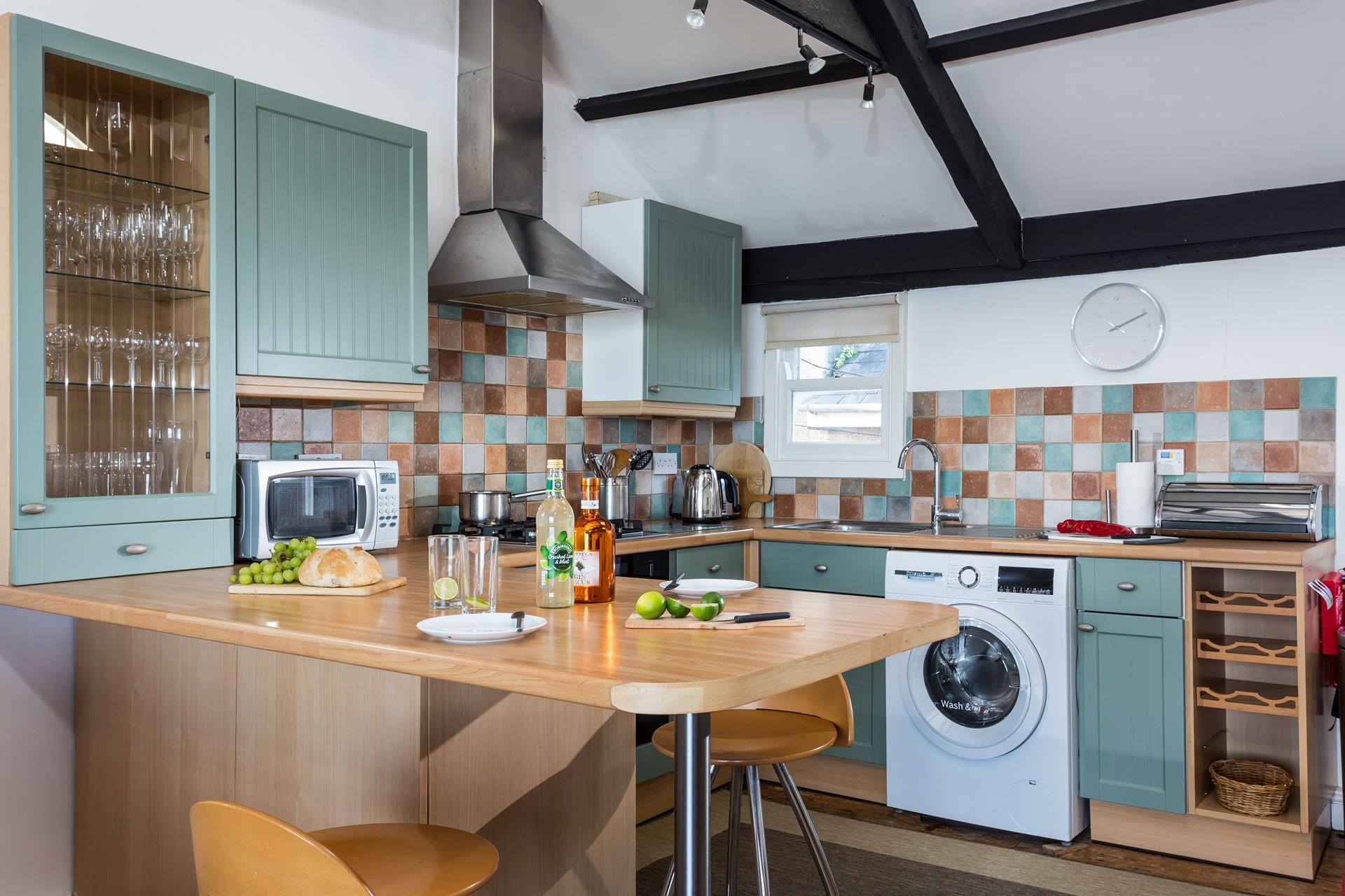 The kitchen is well-equipped with all the appliances needed to cook a tasty meal.