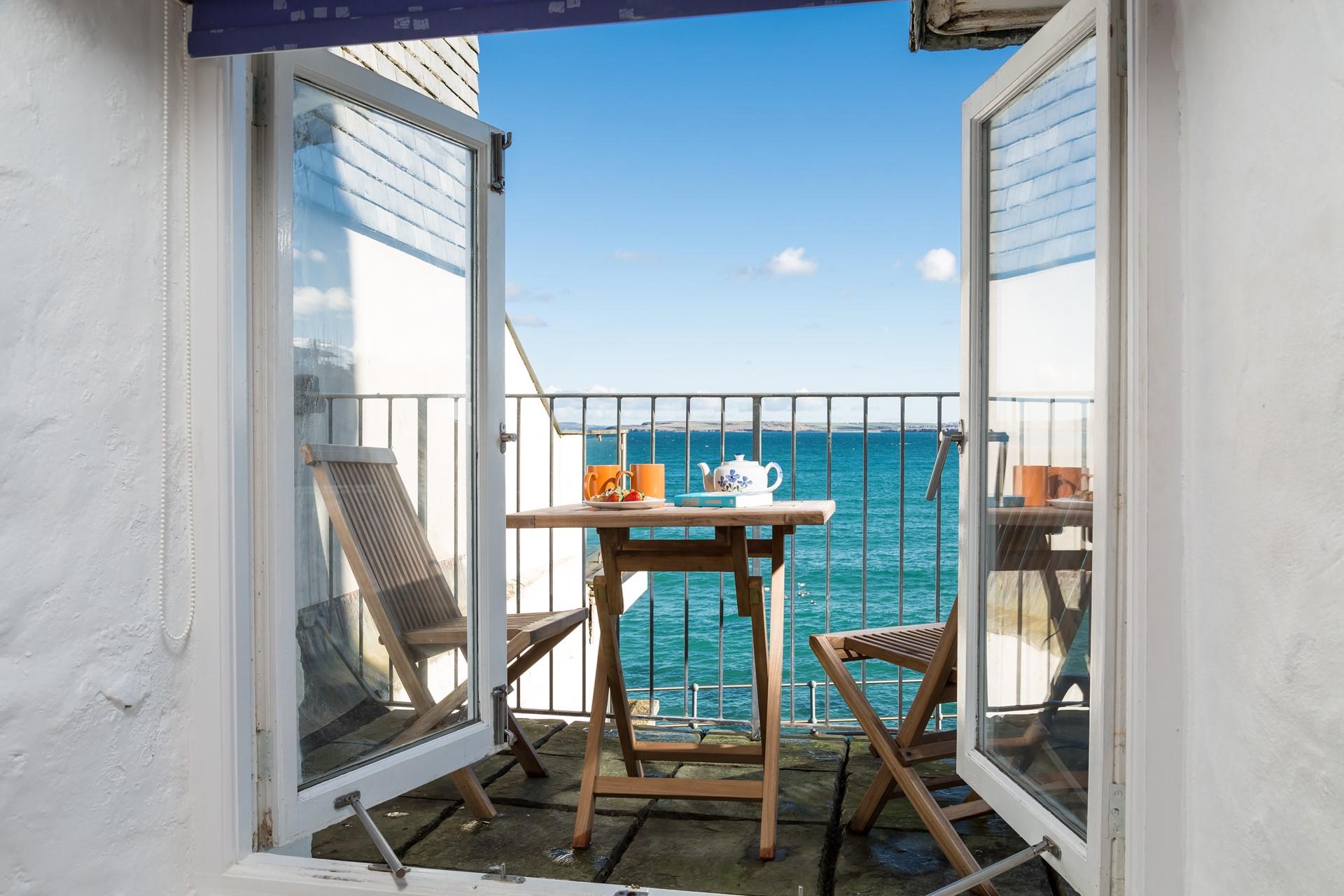 Head out to the balcony for refreshments in the sunshine.