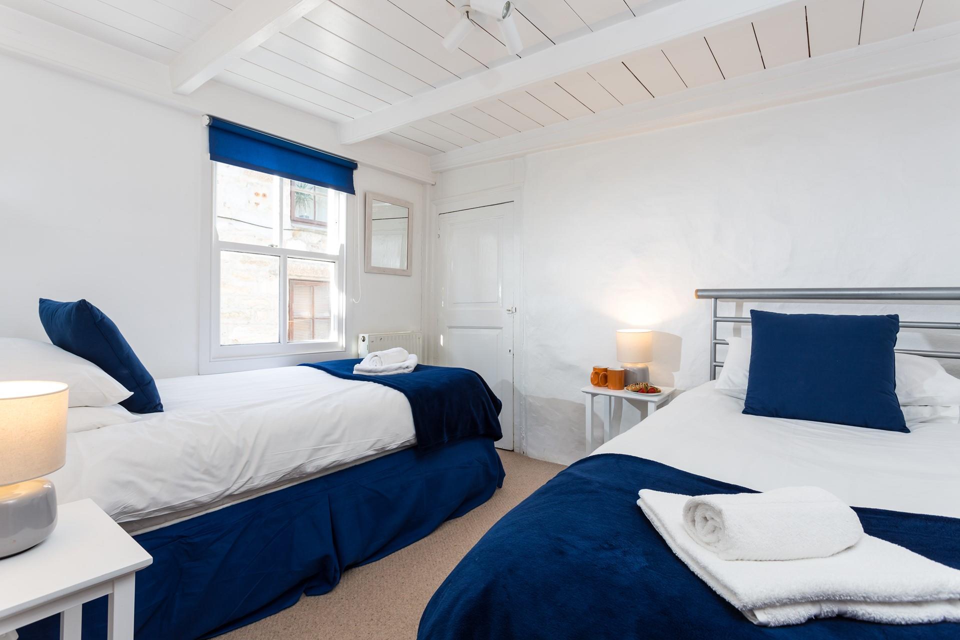 Bedroom 2 has twin beds perfect for adults or children.