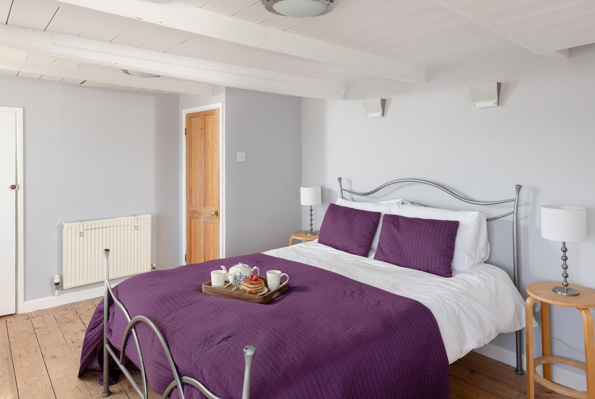 Bedroom 1 has a spacious king-size bed for a dreamy night's sleep.