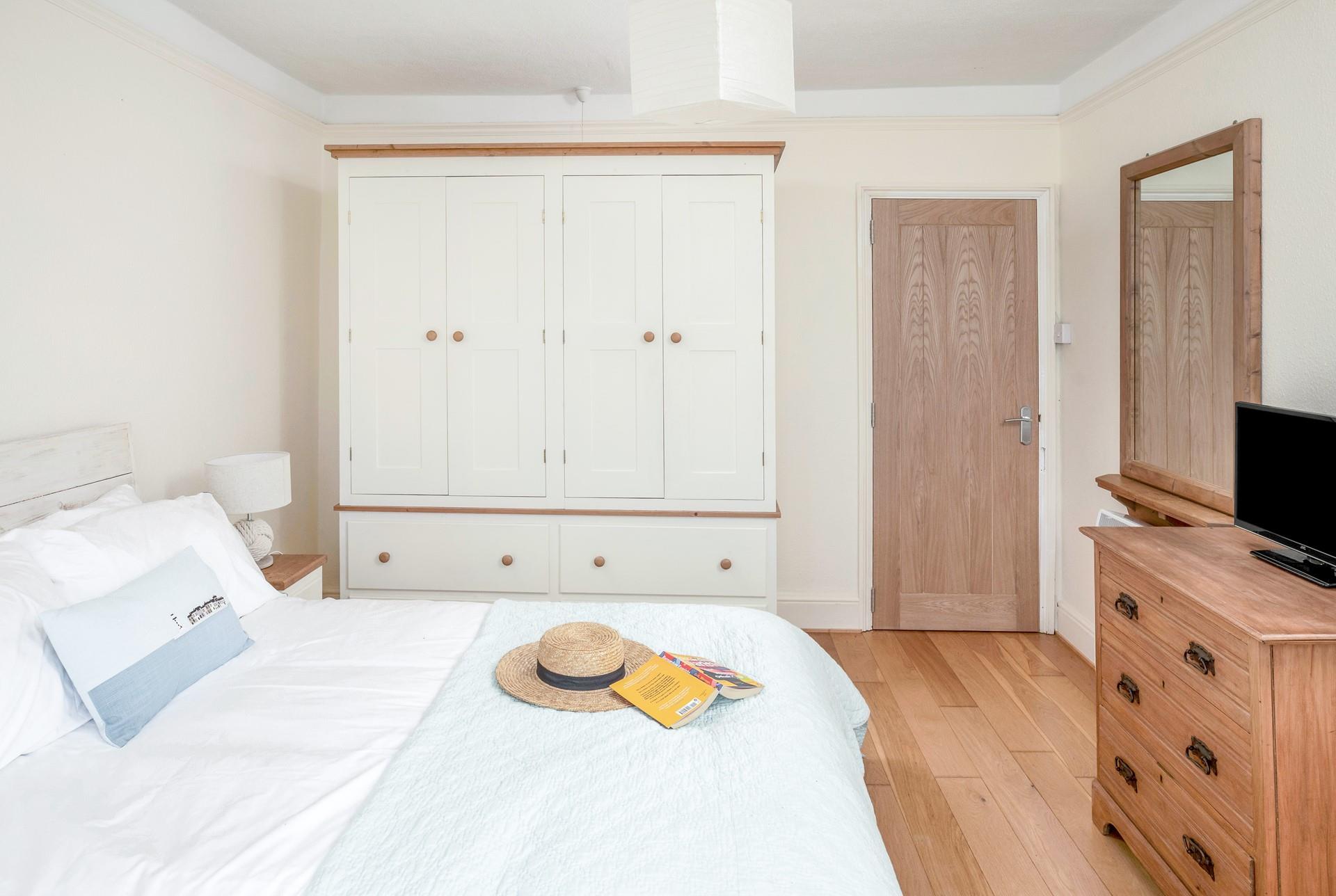 Bedroom 1 is spacious and light, the perfect base to come back to.