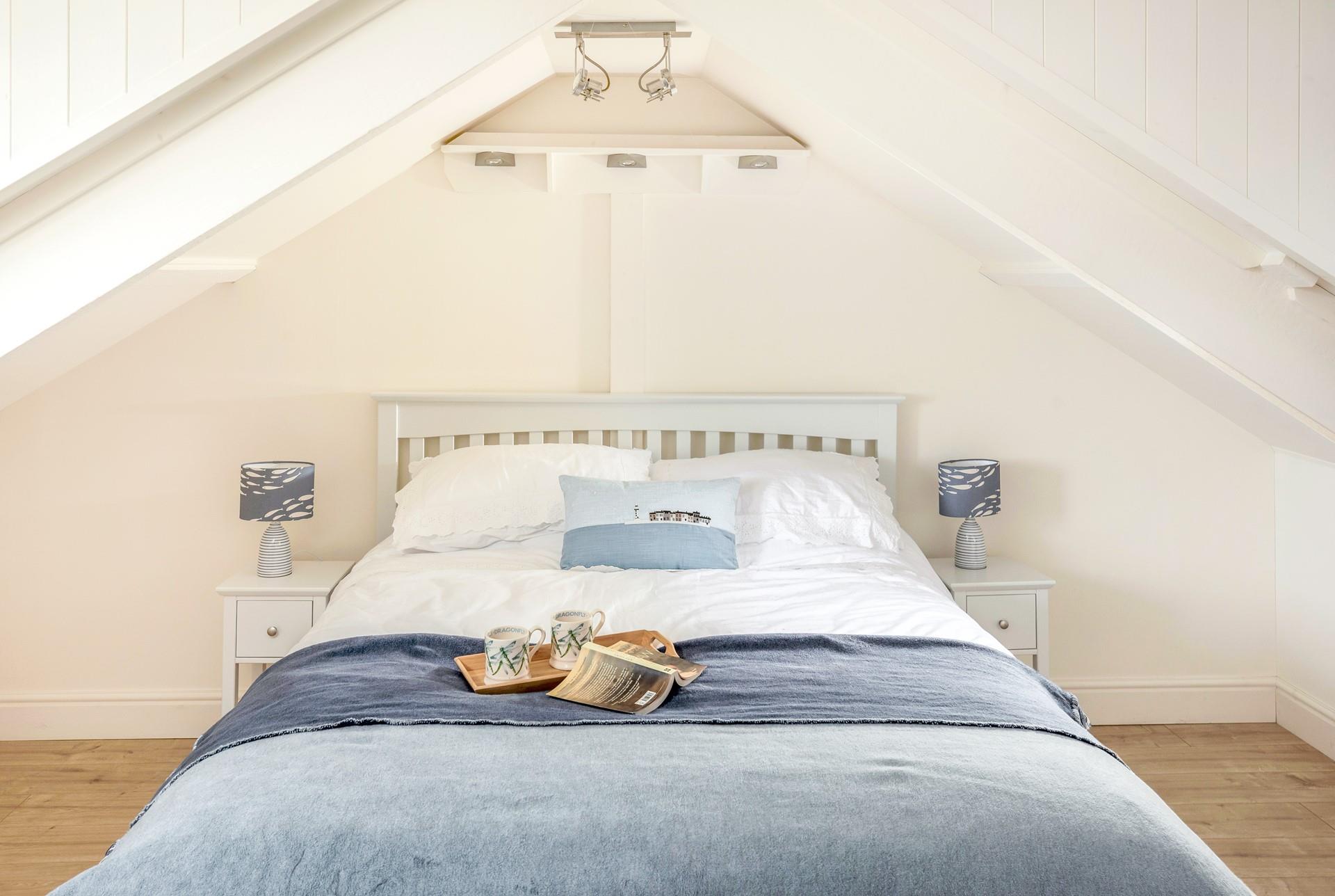 Bedroom 3 has seaside decor and mesmerising sea views.