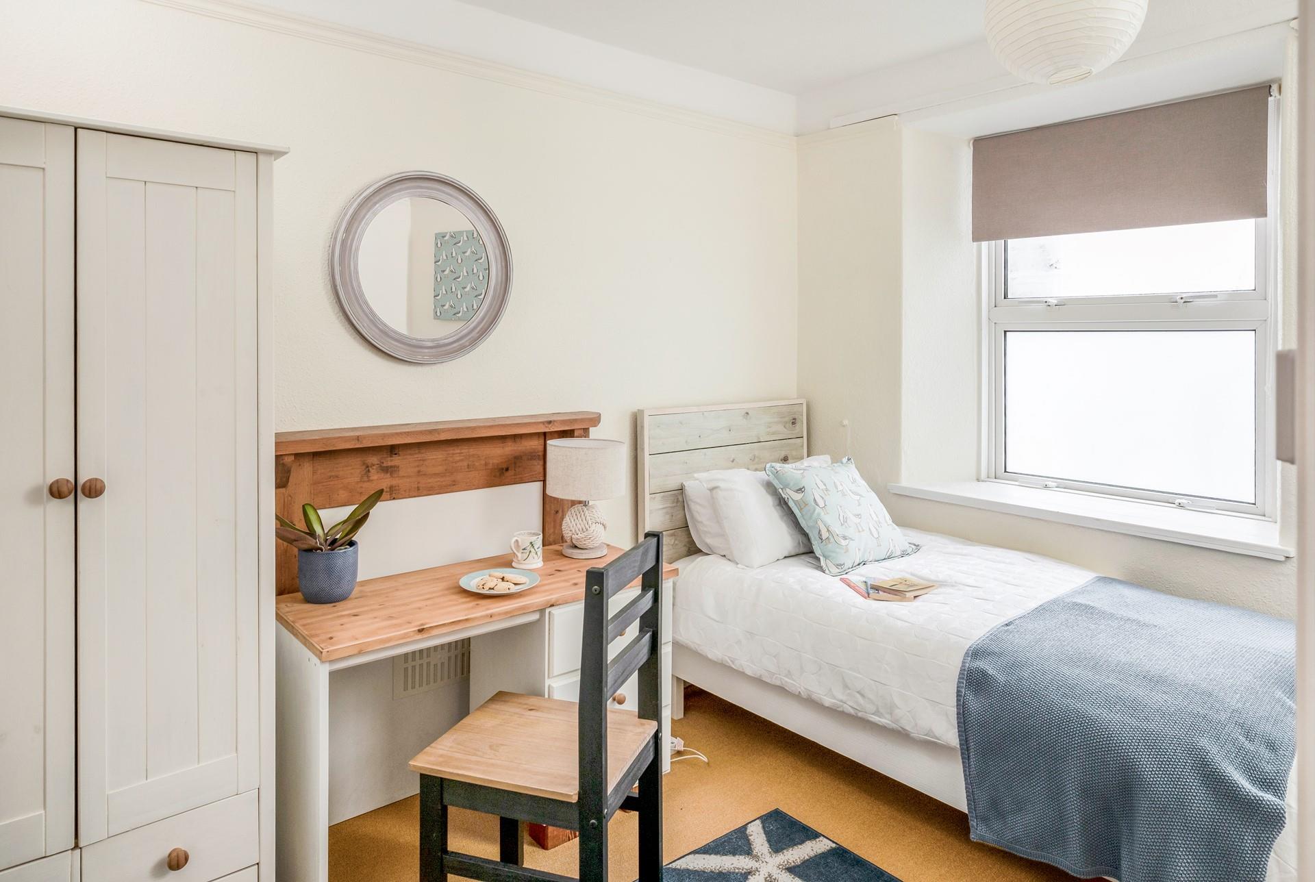 Bedroom 2 has twin beds, perfect for young adults and children.