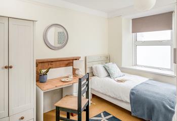 Bedroom 2 has twin beds, perfect for young adults and children.
