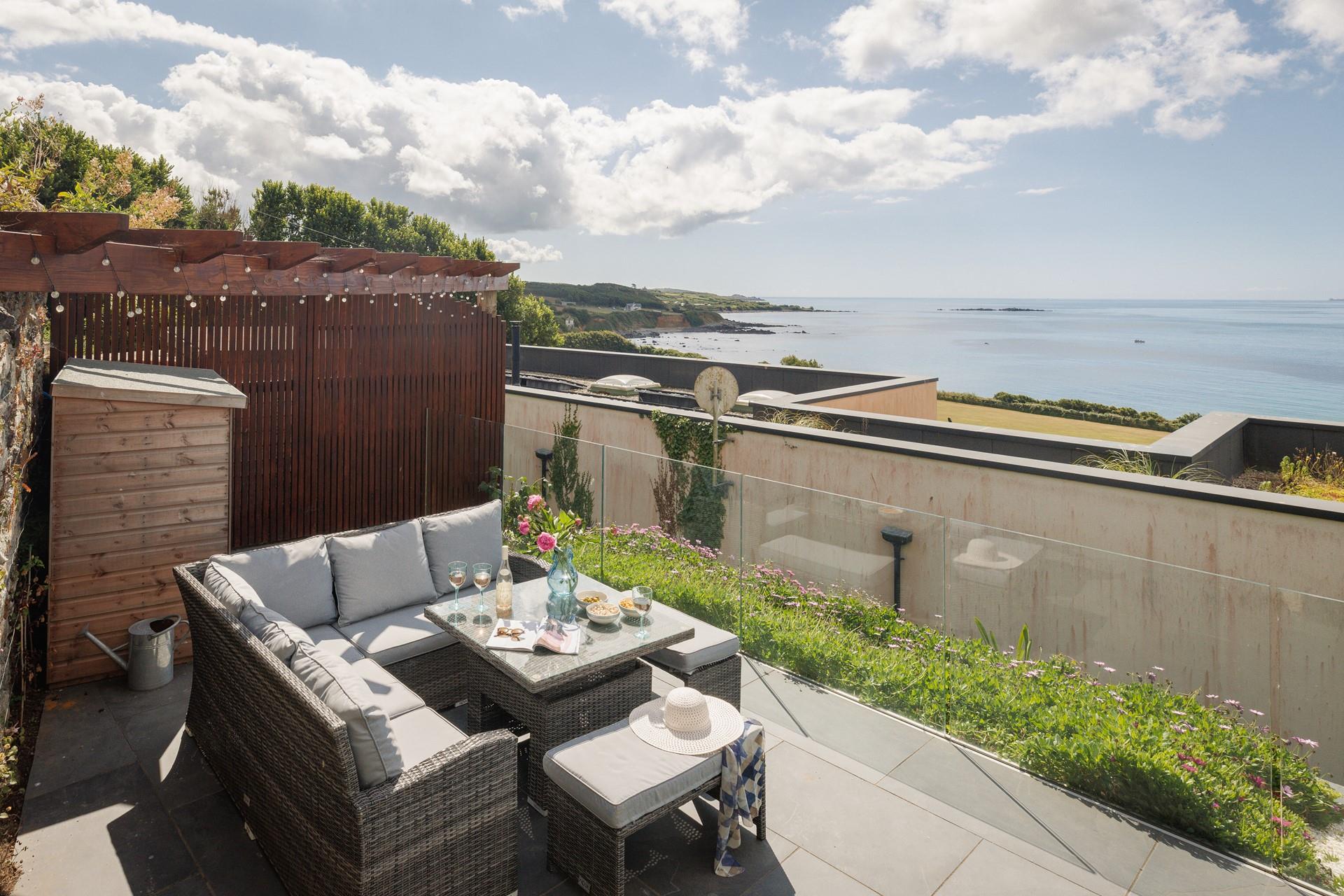 Gaze out at the mesmerising sea views whilst you sip a glass of something cold.