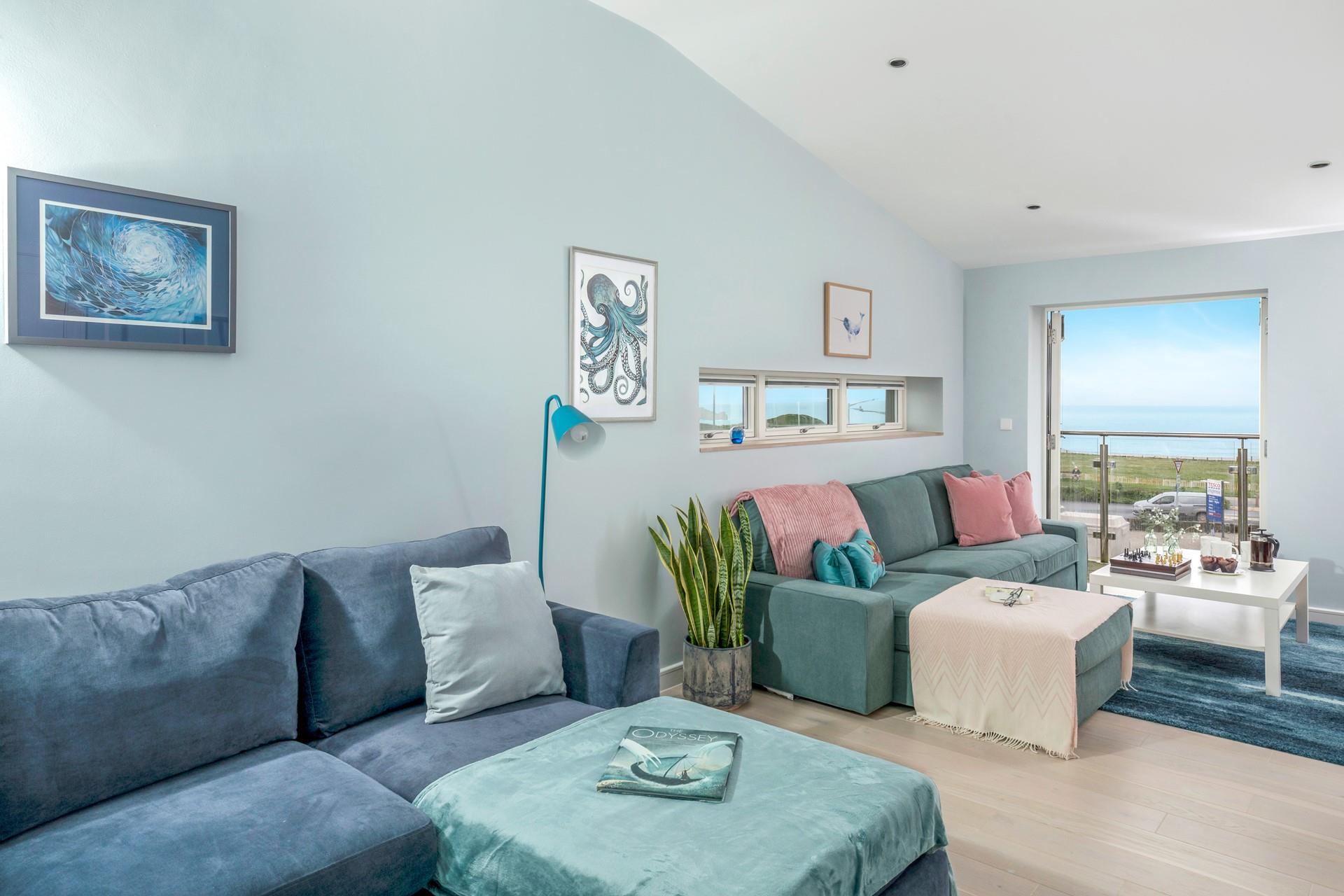 Enjoy a family games night in the sitting room, admiring the sea view.