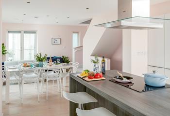 The open plan kitchen/dining space is light and tastefully decorated.