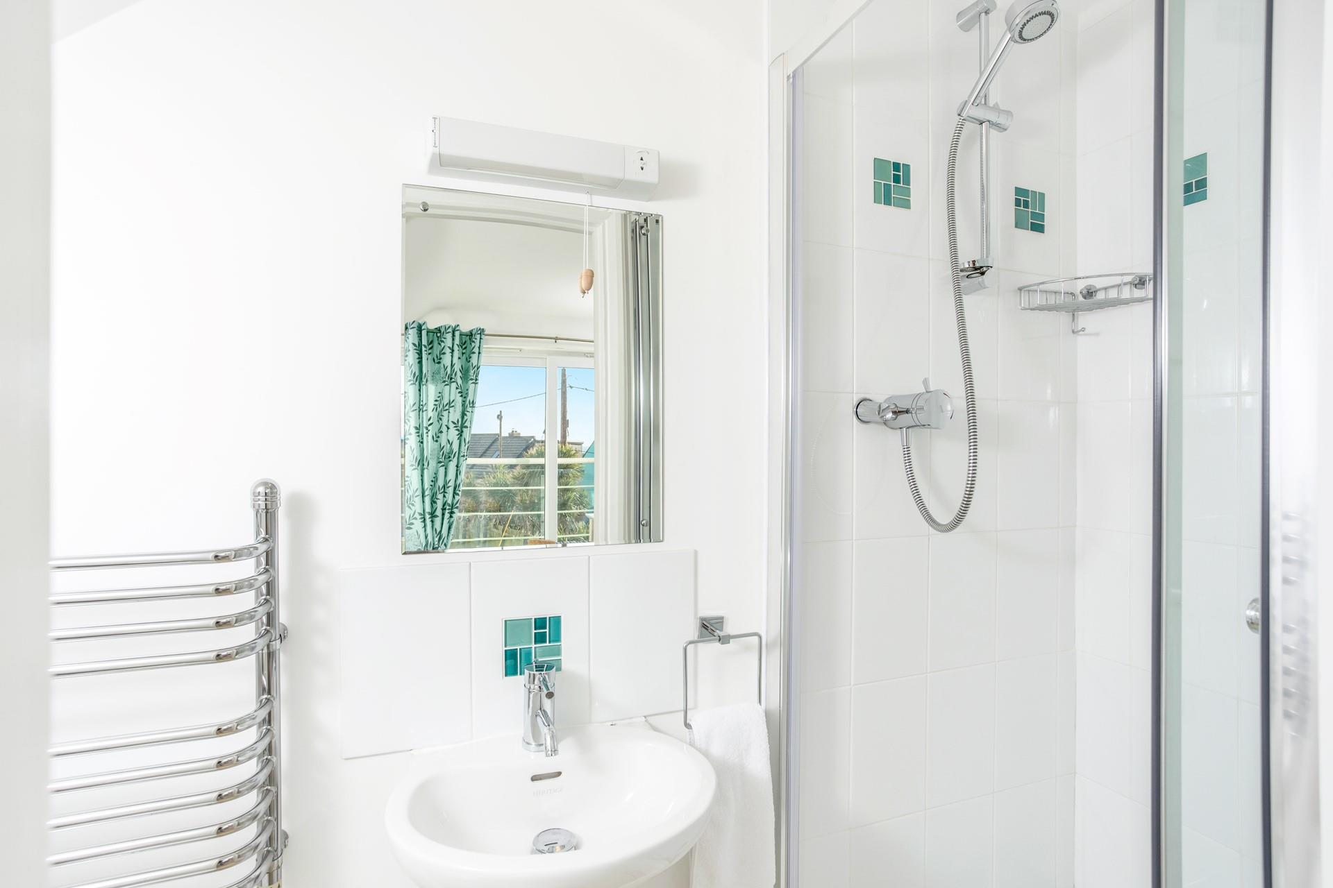 Wash off sandy toes in the shower after a day on the beach.