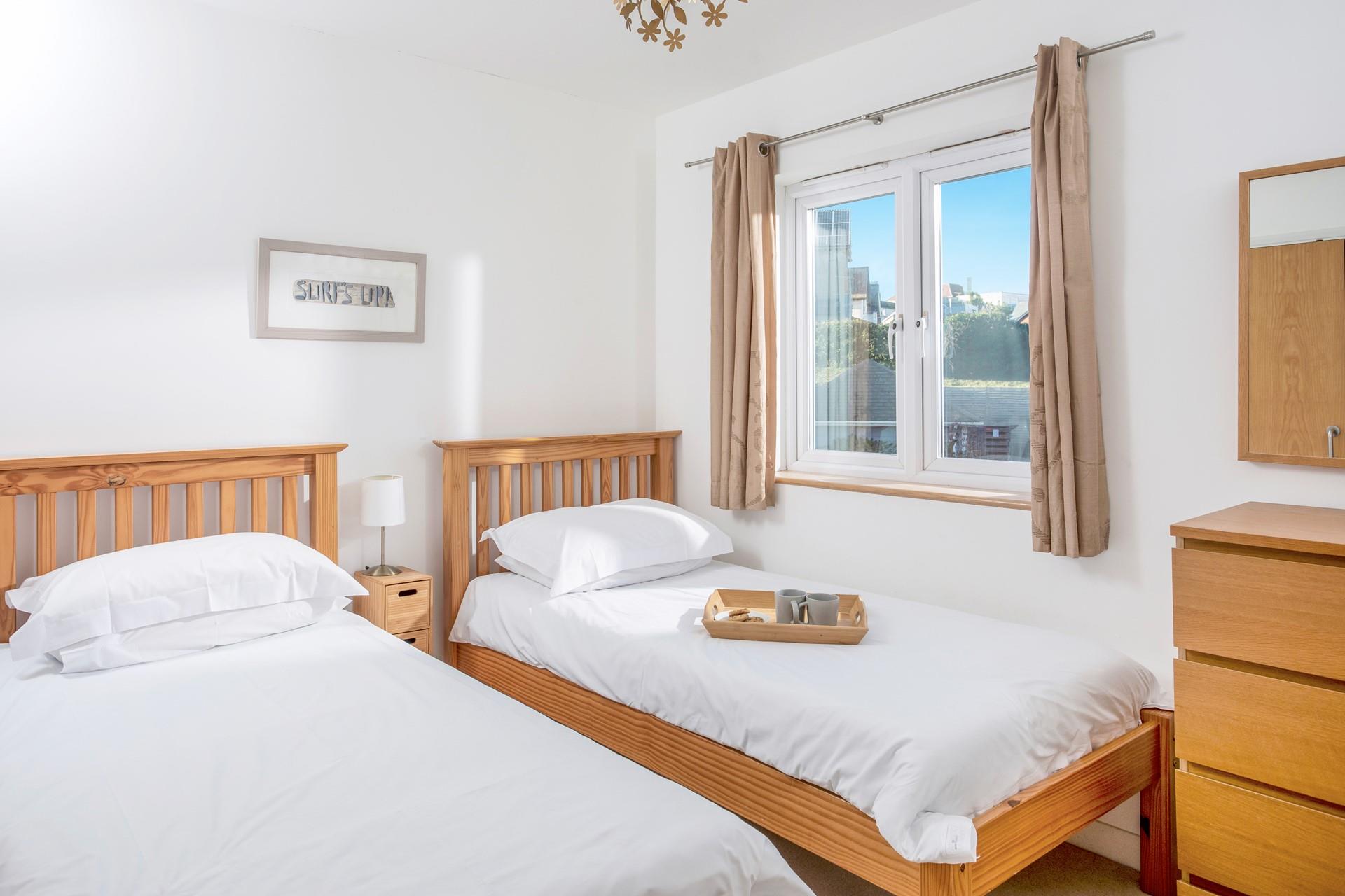 Bedroom 2 has twin beds perfect for young adults or children.