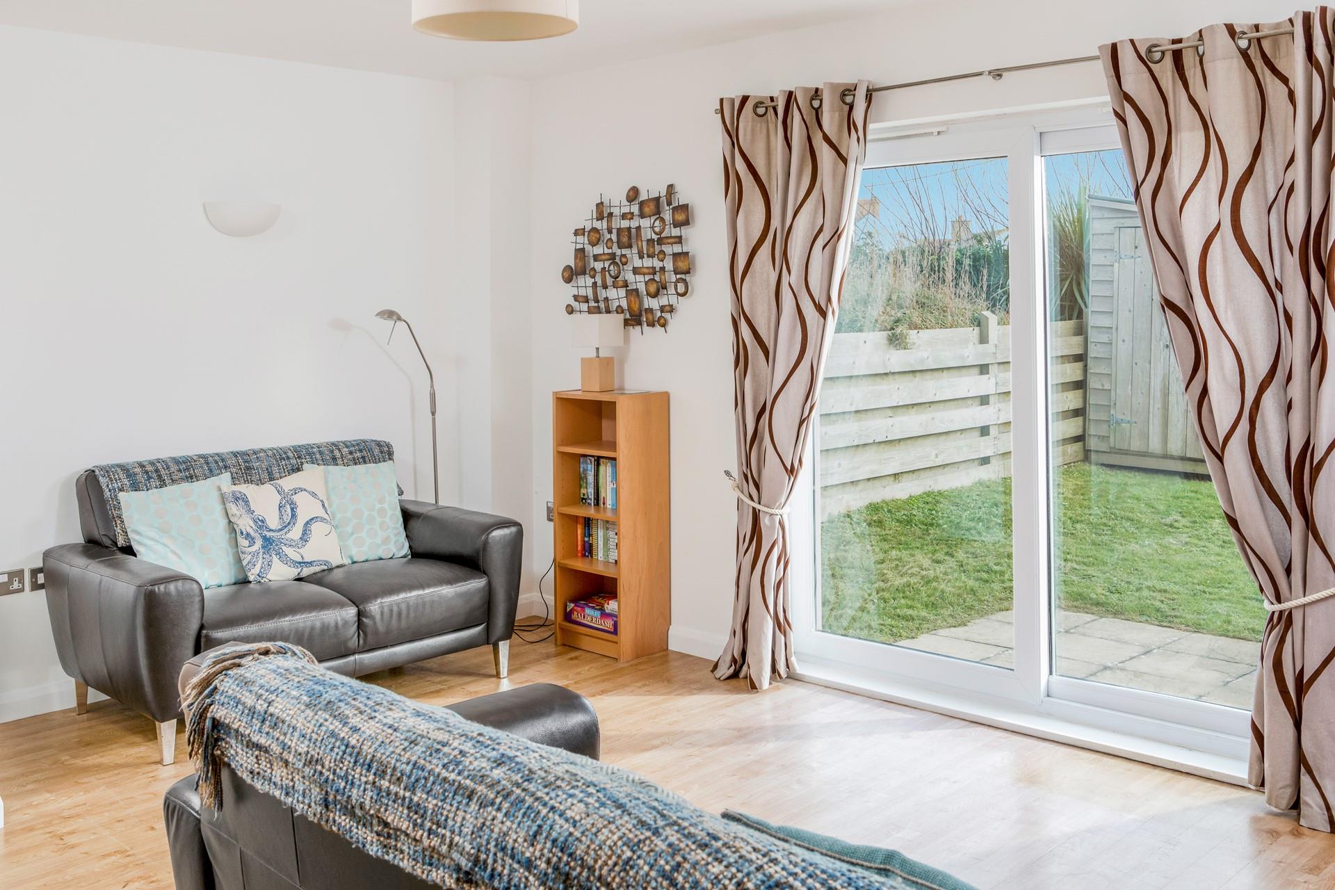 Relax and unwind in the sitting room after a day of exploring Bude.