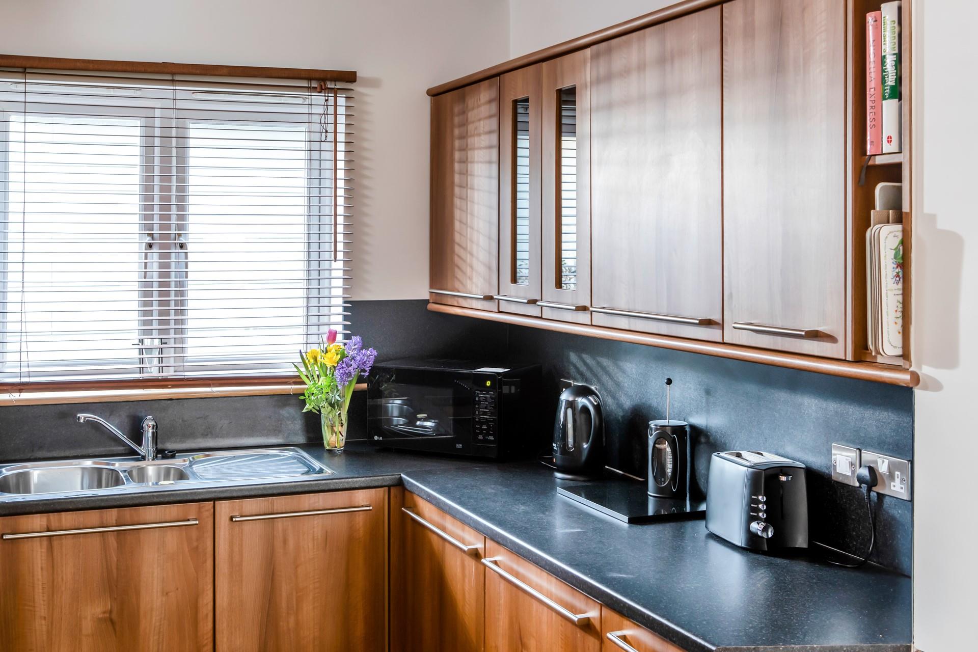 The kitchen has all the appliances needed to prepare and cook tasty meals.
