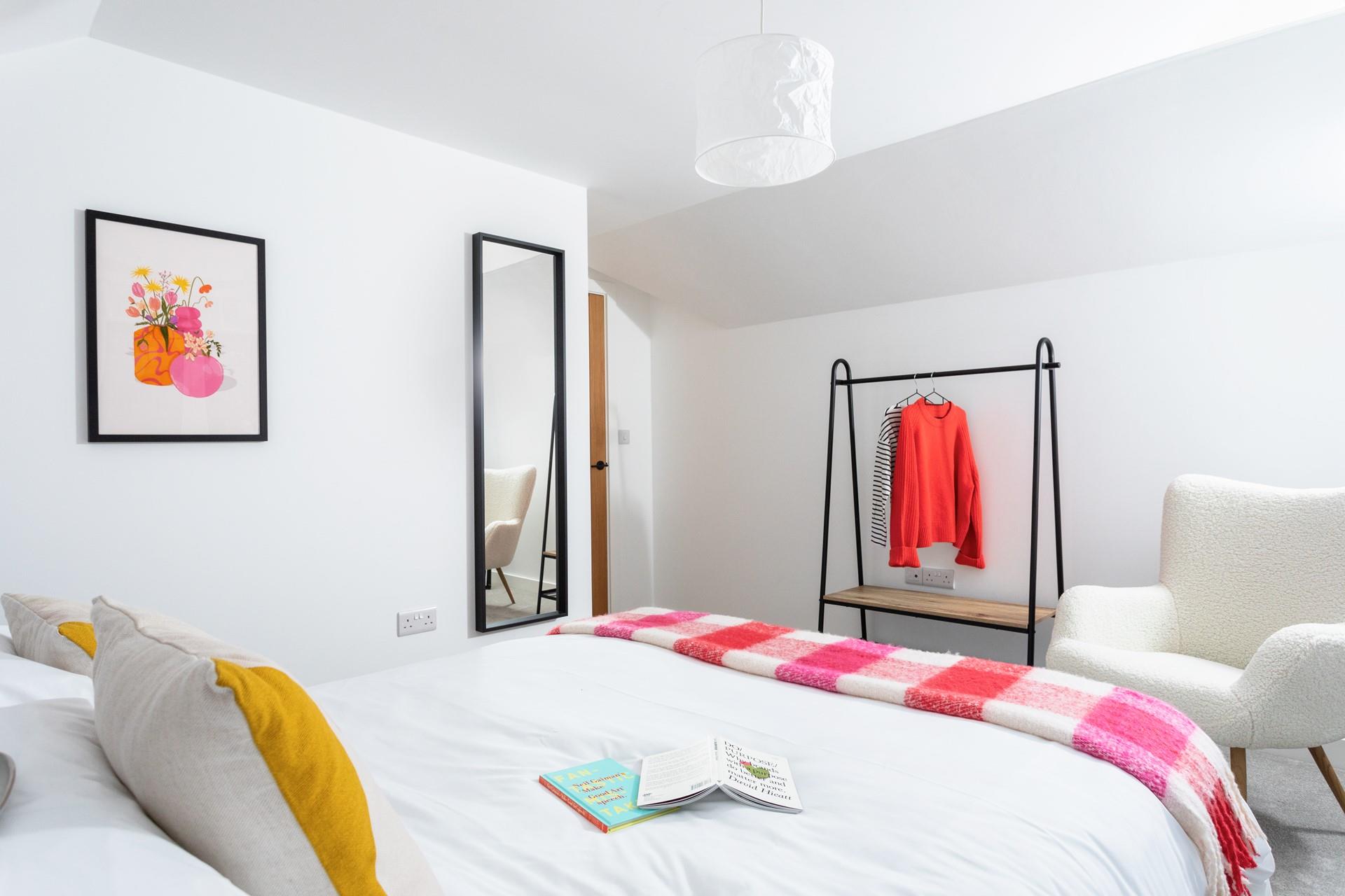 Drift into a dreamy night's sleep in bedroom 3's king size bed.